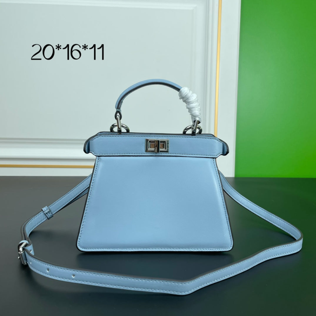 Elegant Light Blue Top Handle Leather Handbag with Adjustable Shoulder Strap