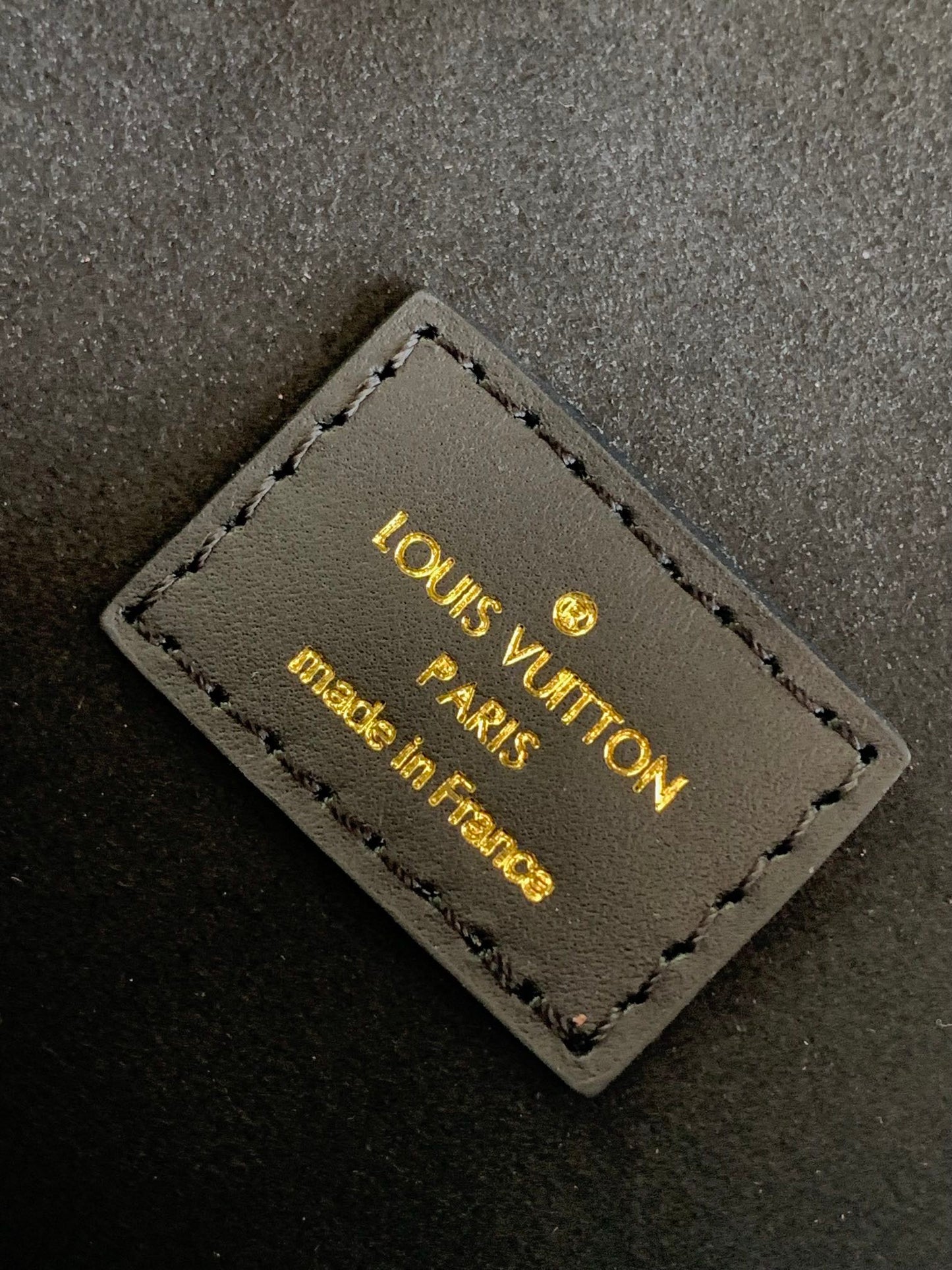 Louis Vuitton Elegant Black Embossed Leather Small Backpack with Flap Closure