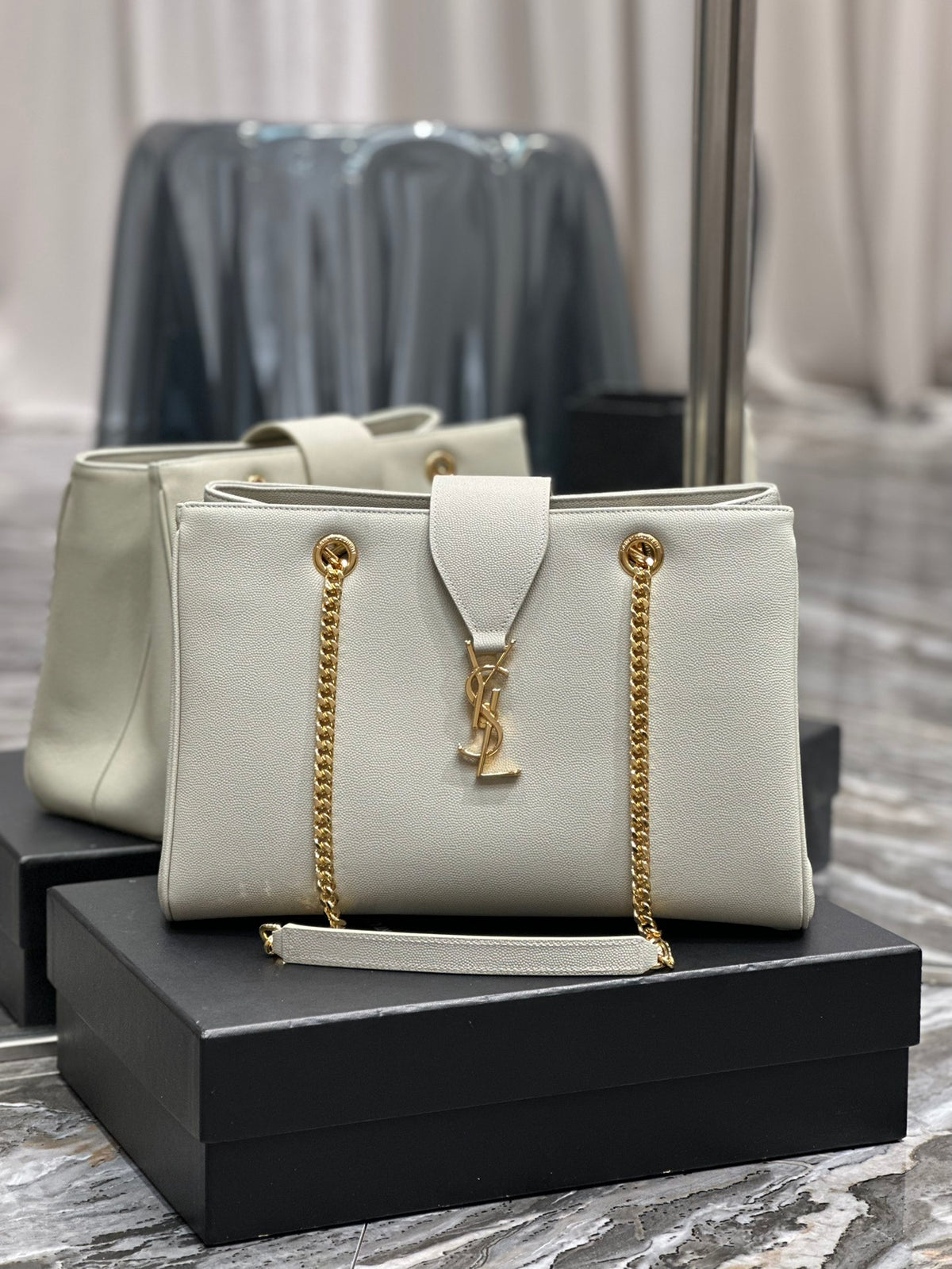 Luxury Off-White Leather Shoulder Bag with Gold Chain and Tassel