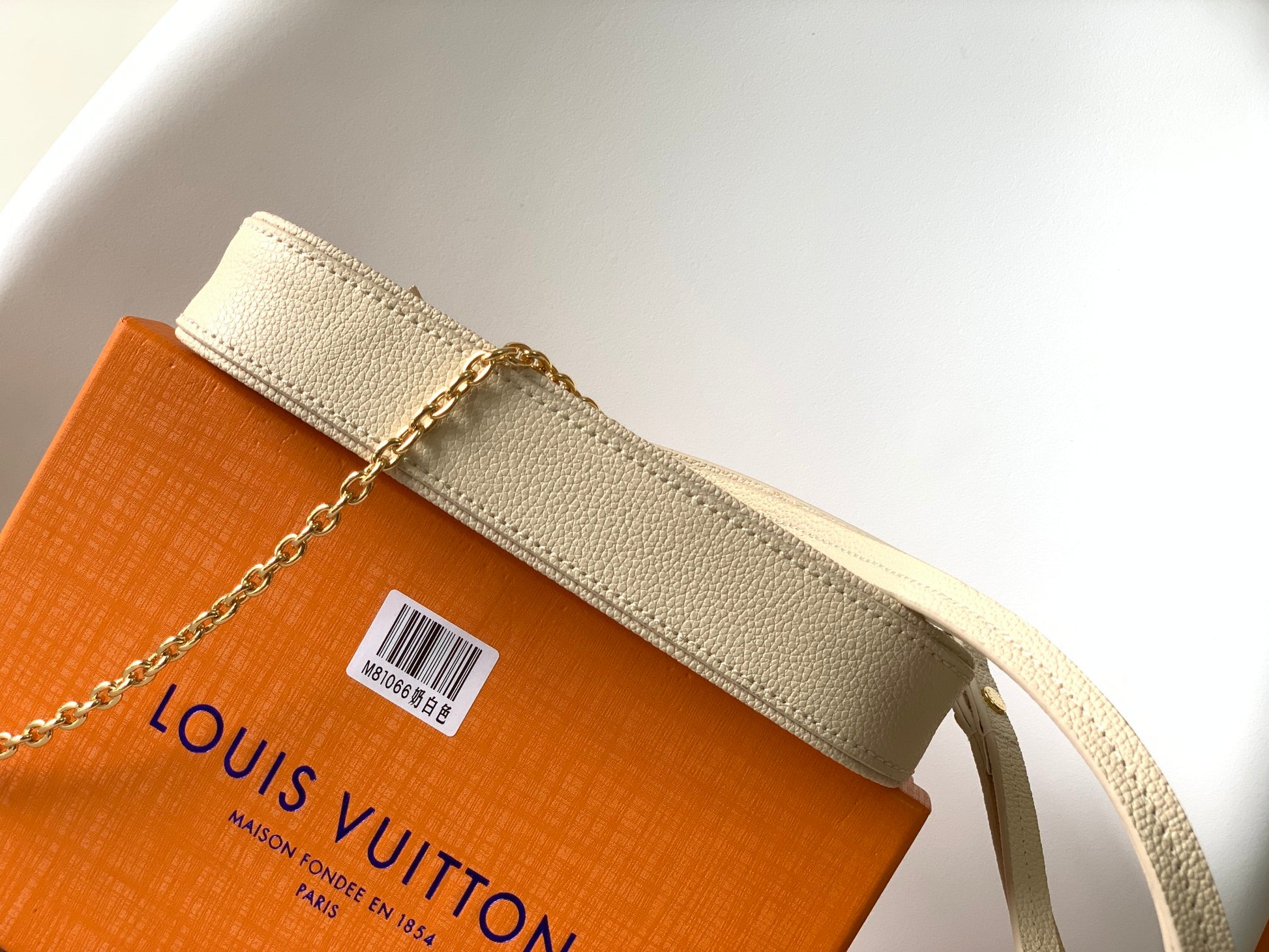Louis Vuitton Elegant Cream Embossed Vegan Leather Underarm Bag with Gold Chain