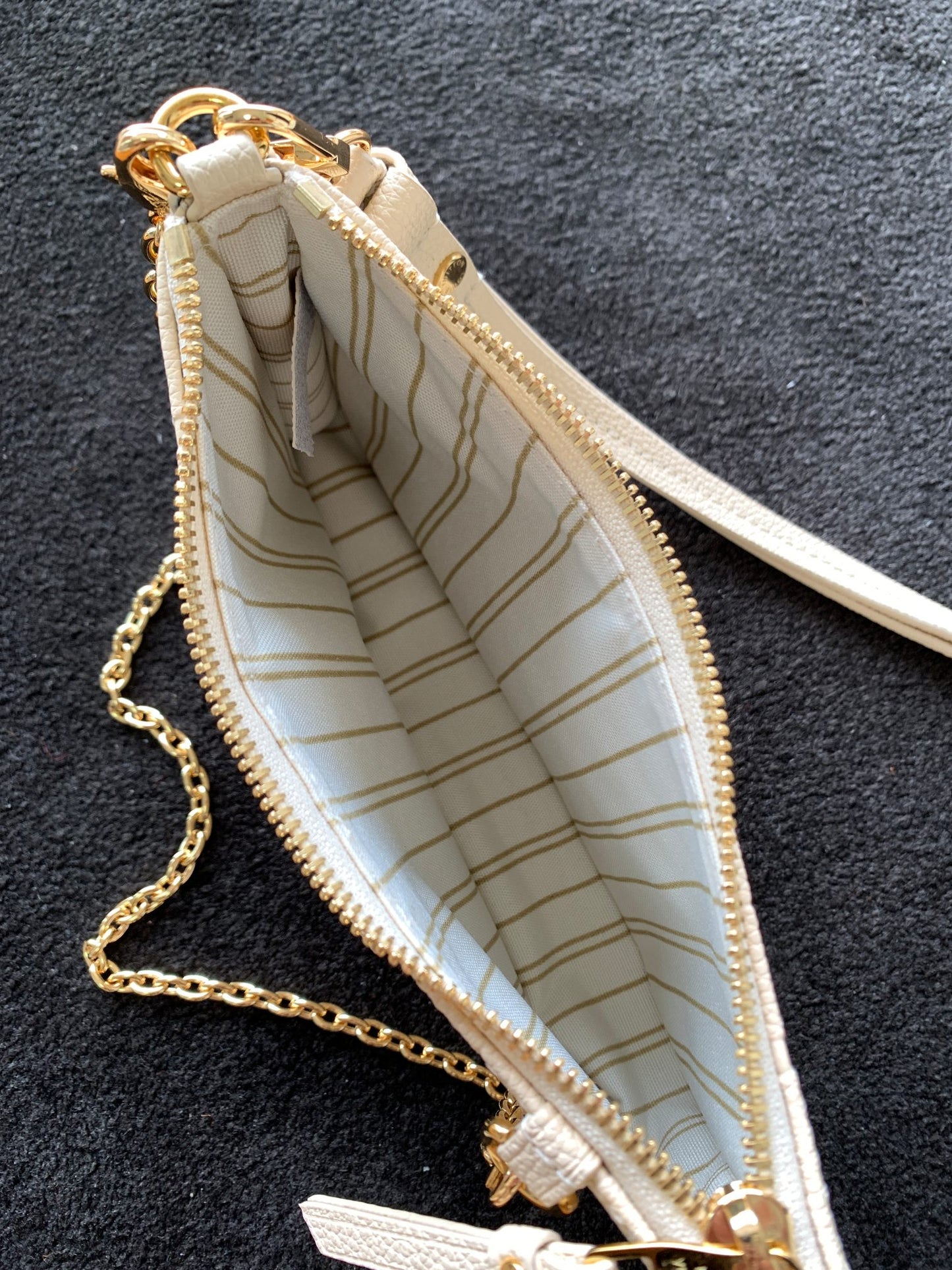 Louis Vuitton Elegant Cream Embossed Vegan Leather Underarm Bag with Gold Chain