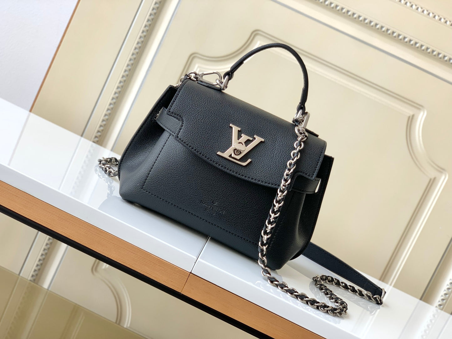Louis Vuitton Elegant Black Leather Top Handle Handbag with Silver Metal Clasp
