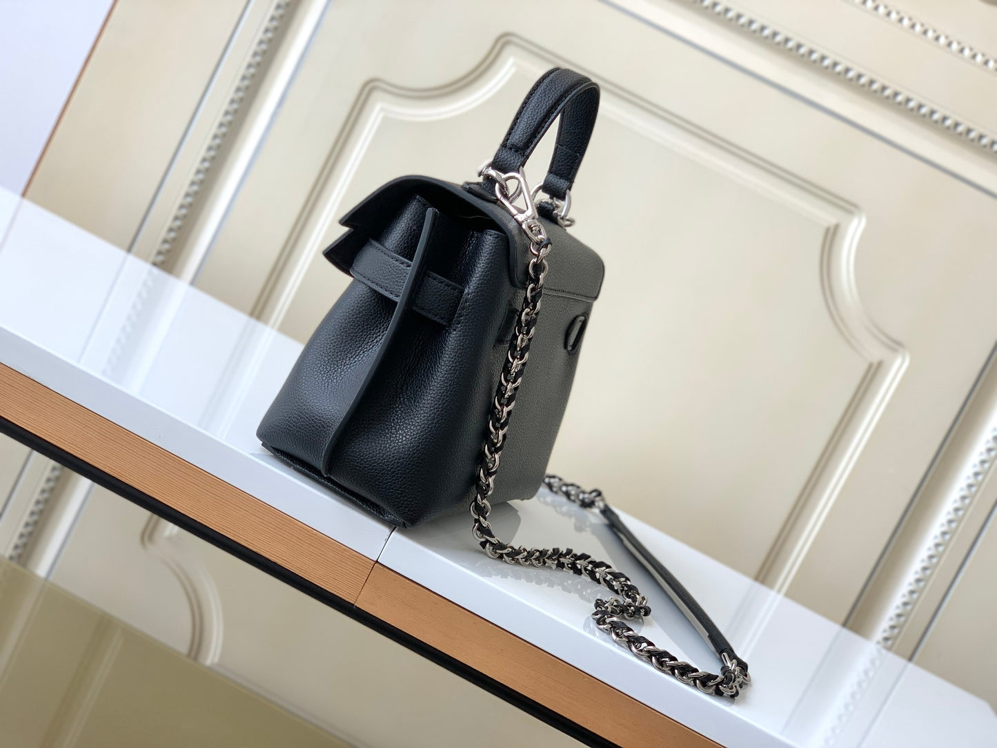 Louis Vuitton Elegant Black Leather Top Handle Handbag with Silver Metal Clasp
