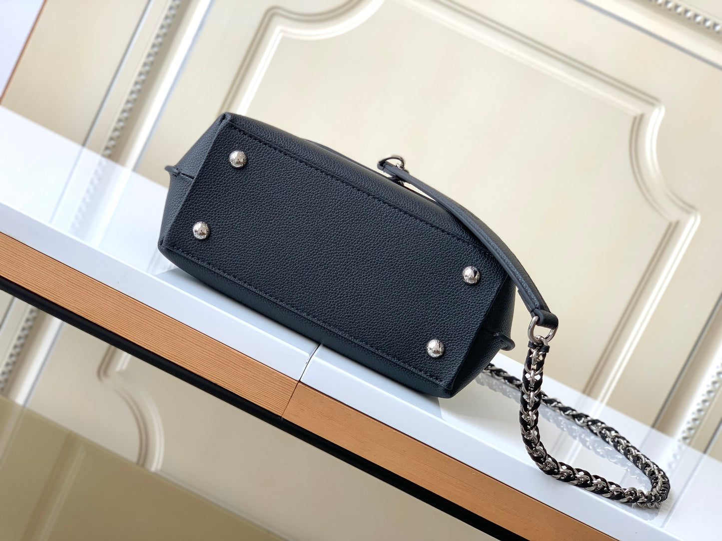 Louis Vuitton Elegant Black Leather Top Handle Handbag with Silver Metal Clasp
