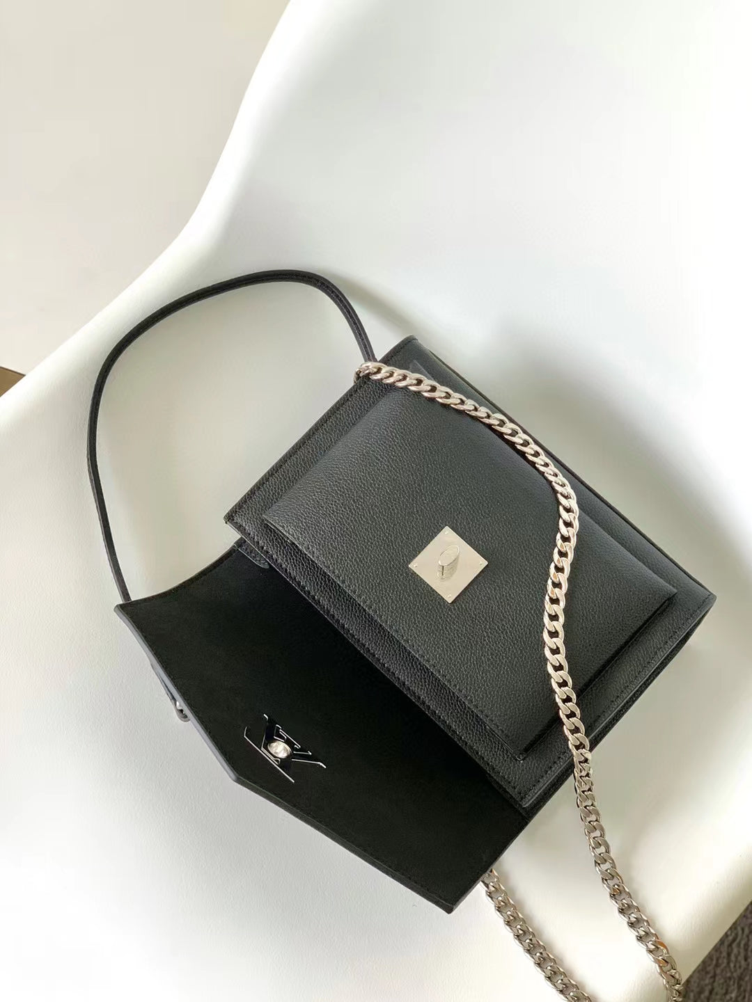 Louis Vuitton Elegant Black Leather Envelope Handbag with Silver Chain Strap