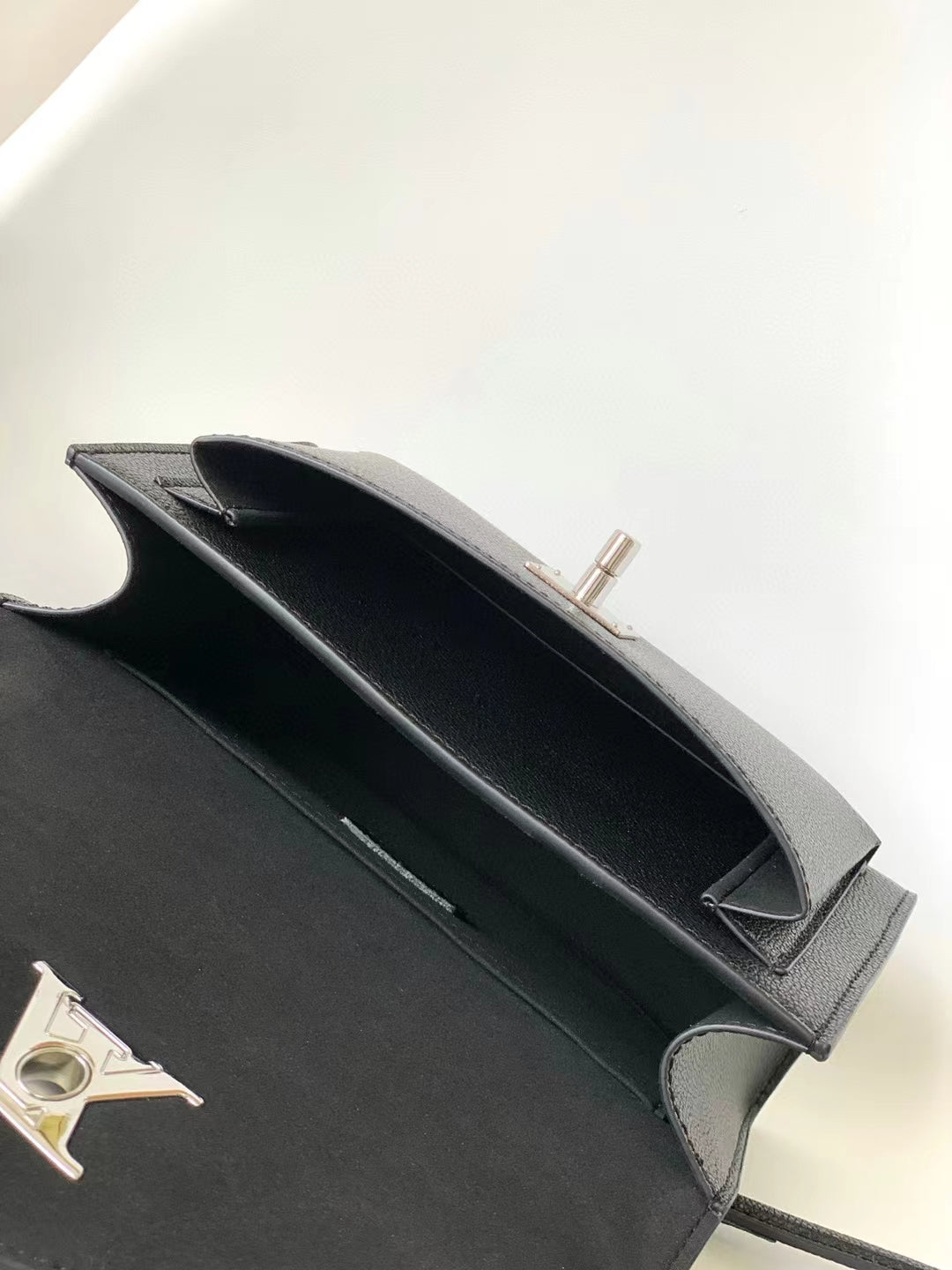 Louis Vuitton Elegant Black Leather Envelope Handbag with Silver Chain Strap