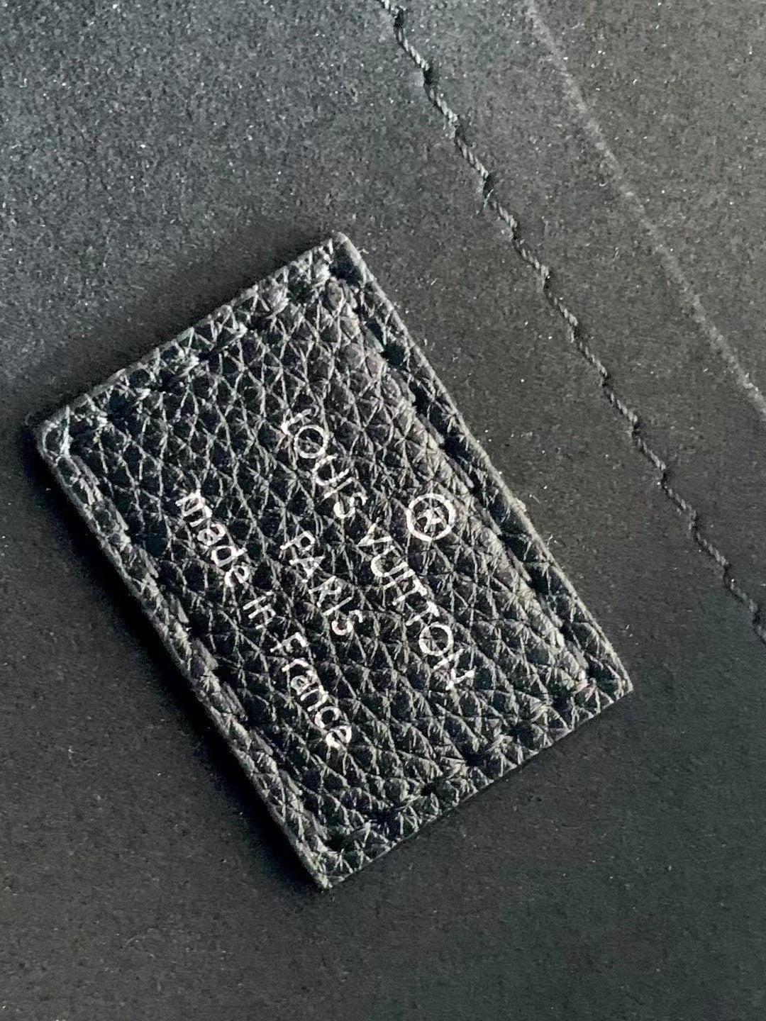 Louis Vuitton Elegant Black Leather Envelope Handbag with Silver Chain Strap