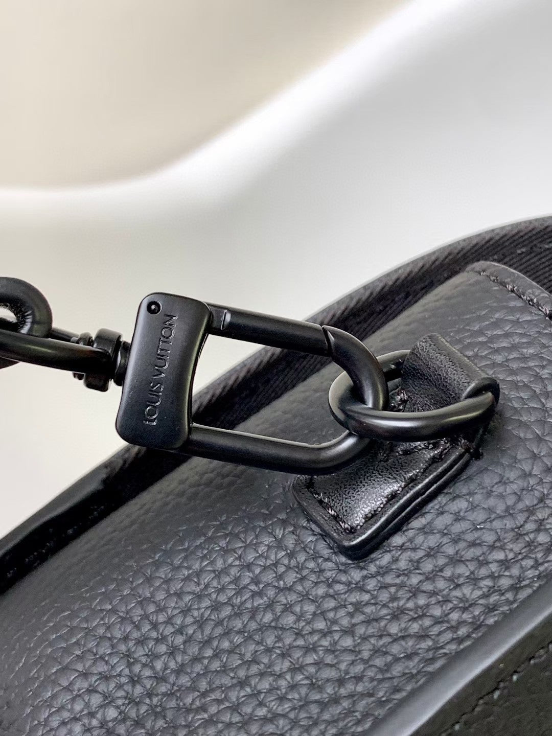 Louis Vuitton Sleek Black Leather Crossbody Bag with Adjustable Strap