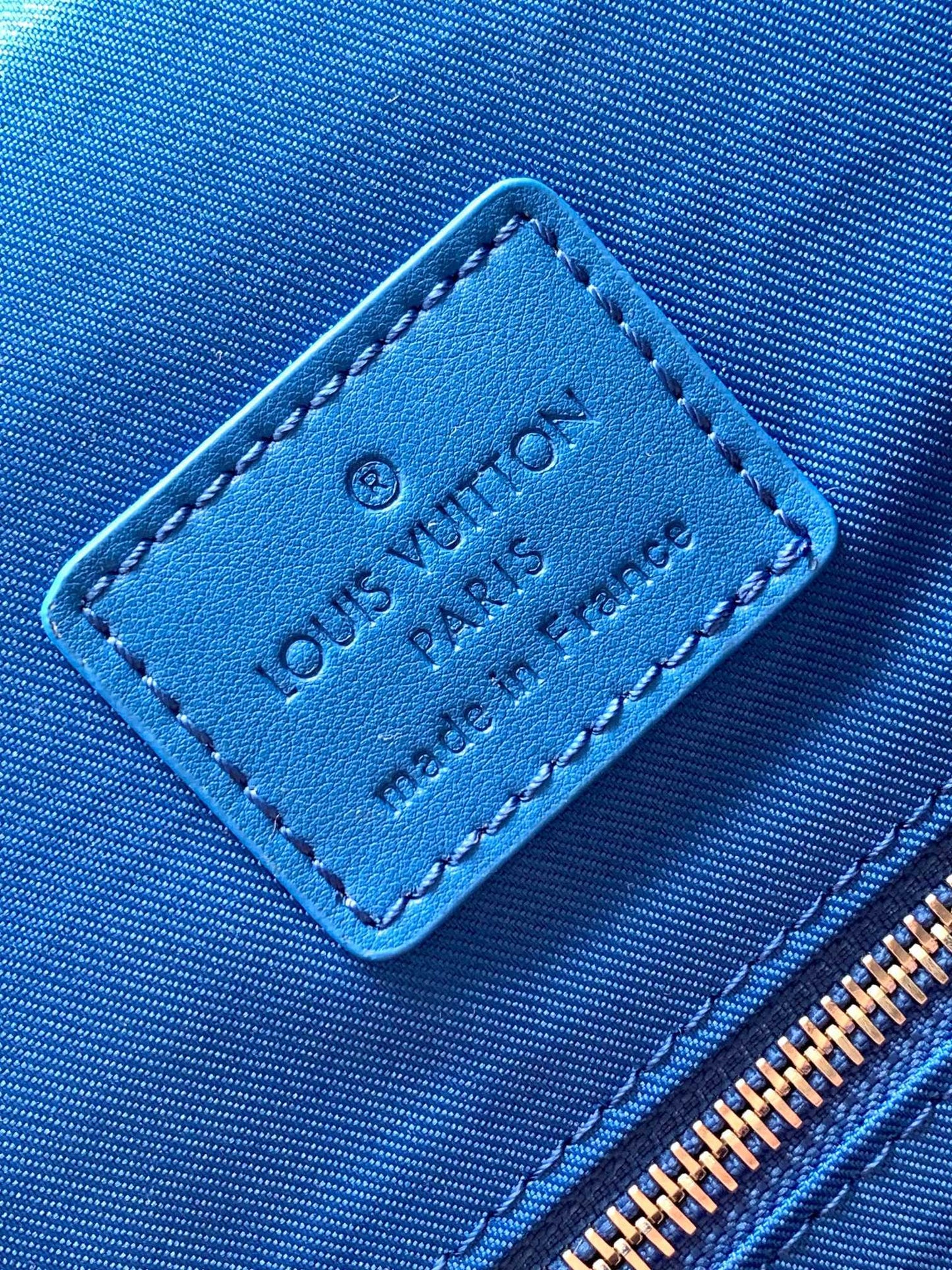 Louis Vuitton Luxury Monogram Canvas Backpack with Bright Blue Leather Straps