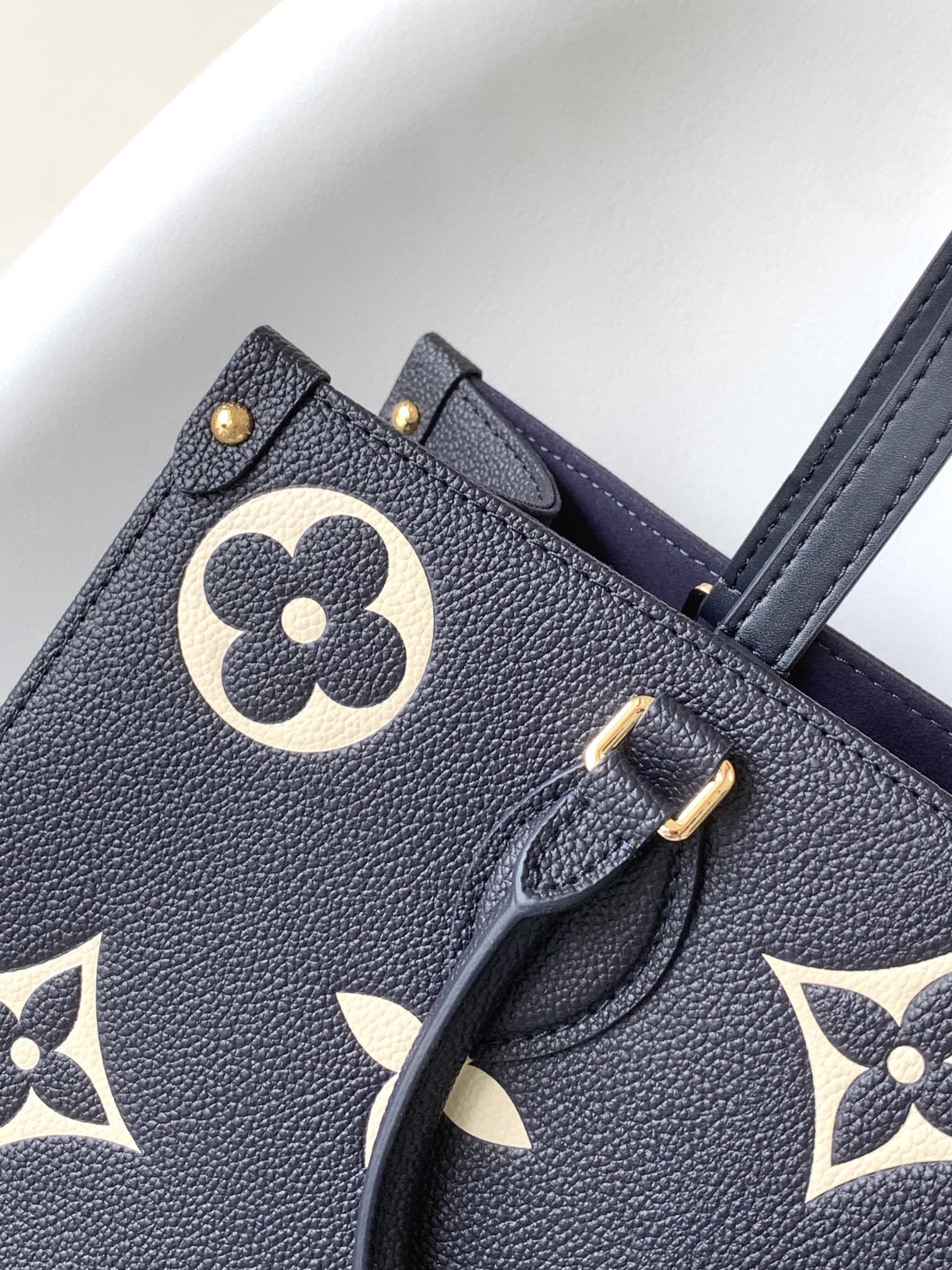 Louis Vuitton Elegant Navy Blue Leather Tote Bag with Floral Monogram Pattern
