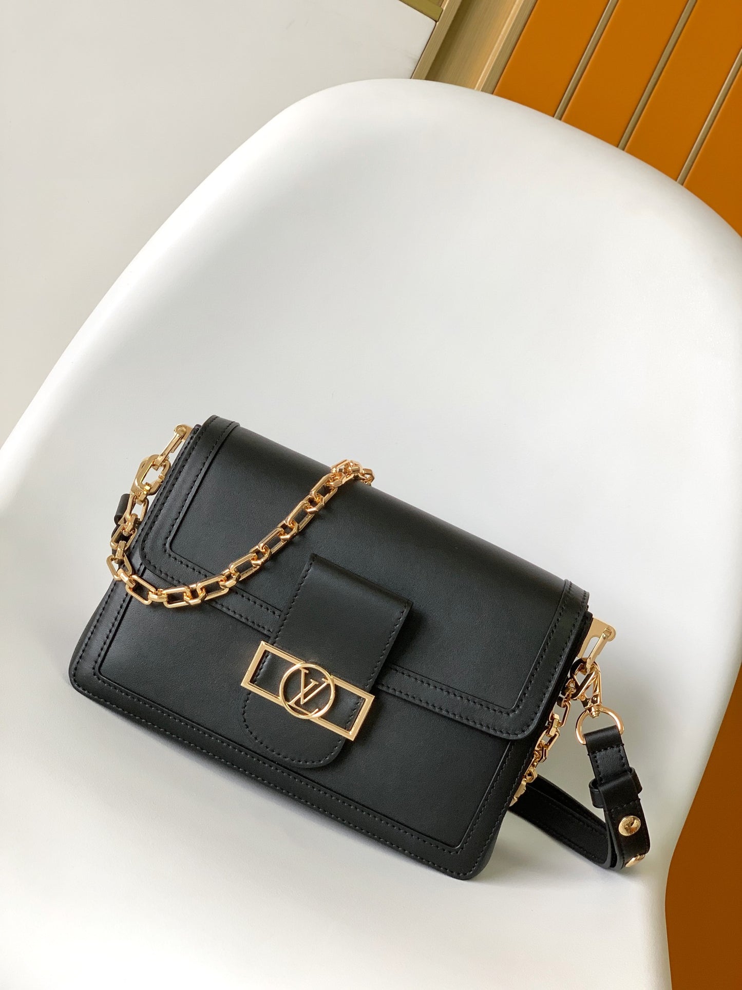 Louis Vuitton Elegant Black Faux Leather Crossbody Bag with Gold Chain Strap