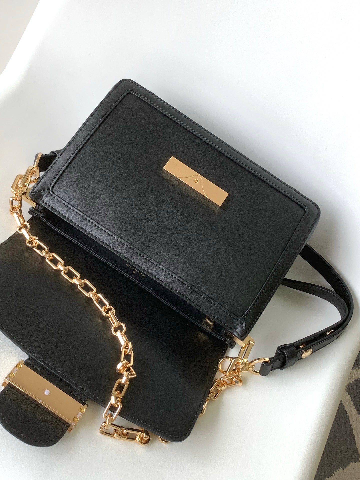 Louis Vuitton Elegant Black Faux Leather Crossbody Bag with Gold Chain Strap