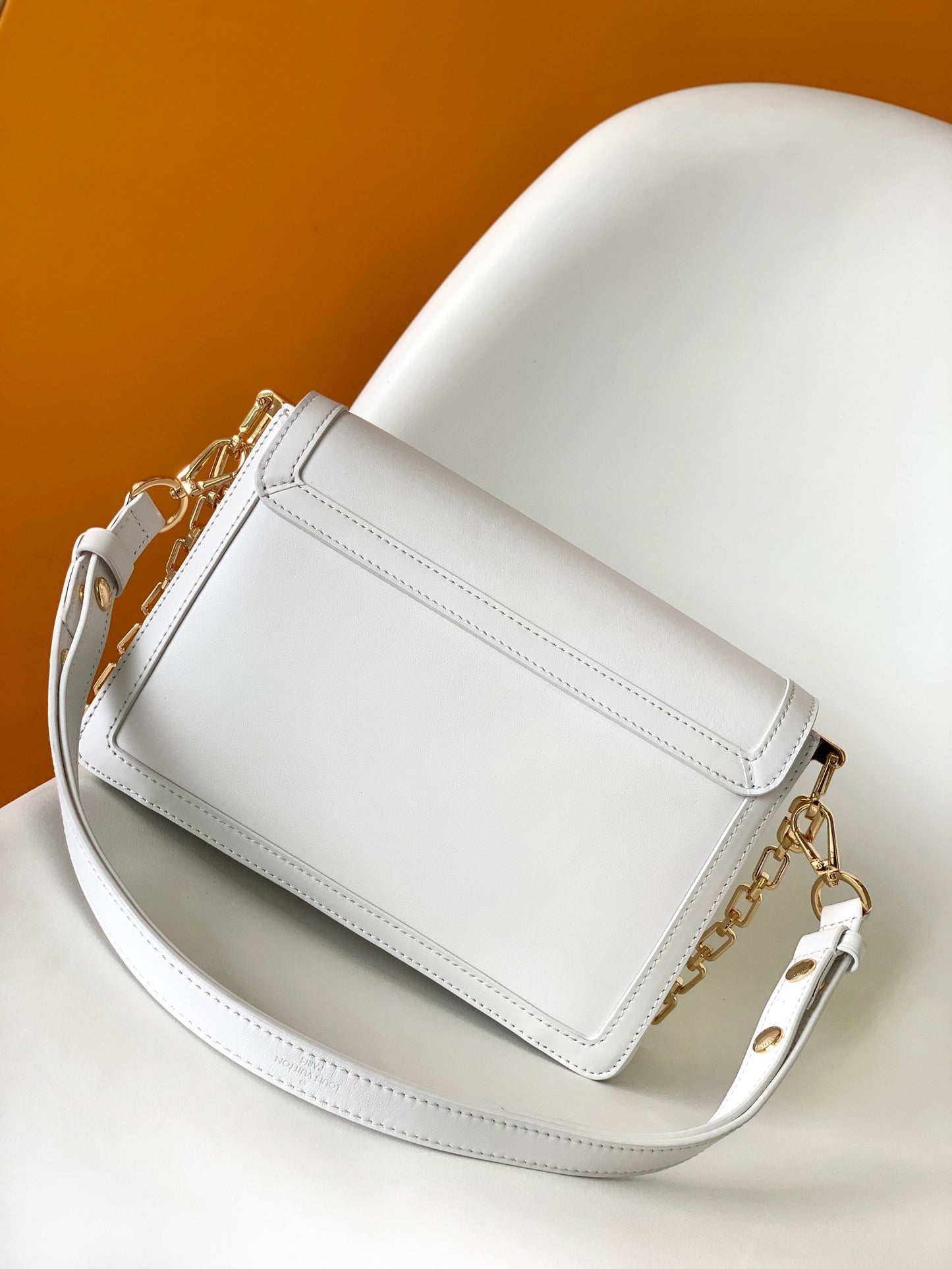 Louis Vuitton Elegant White Leather Crossbody Bag with Gold Chain Strap