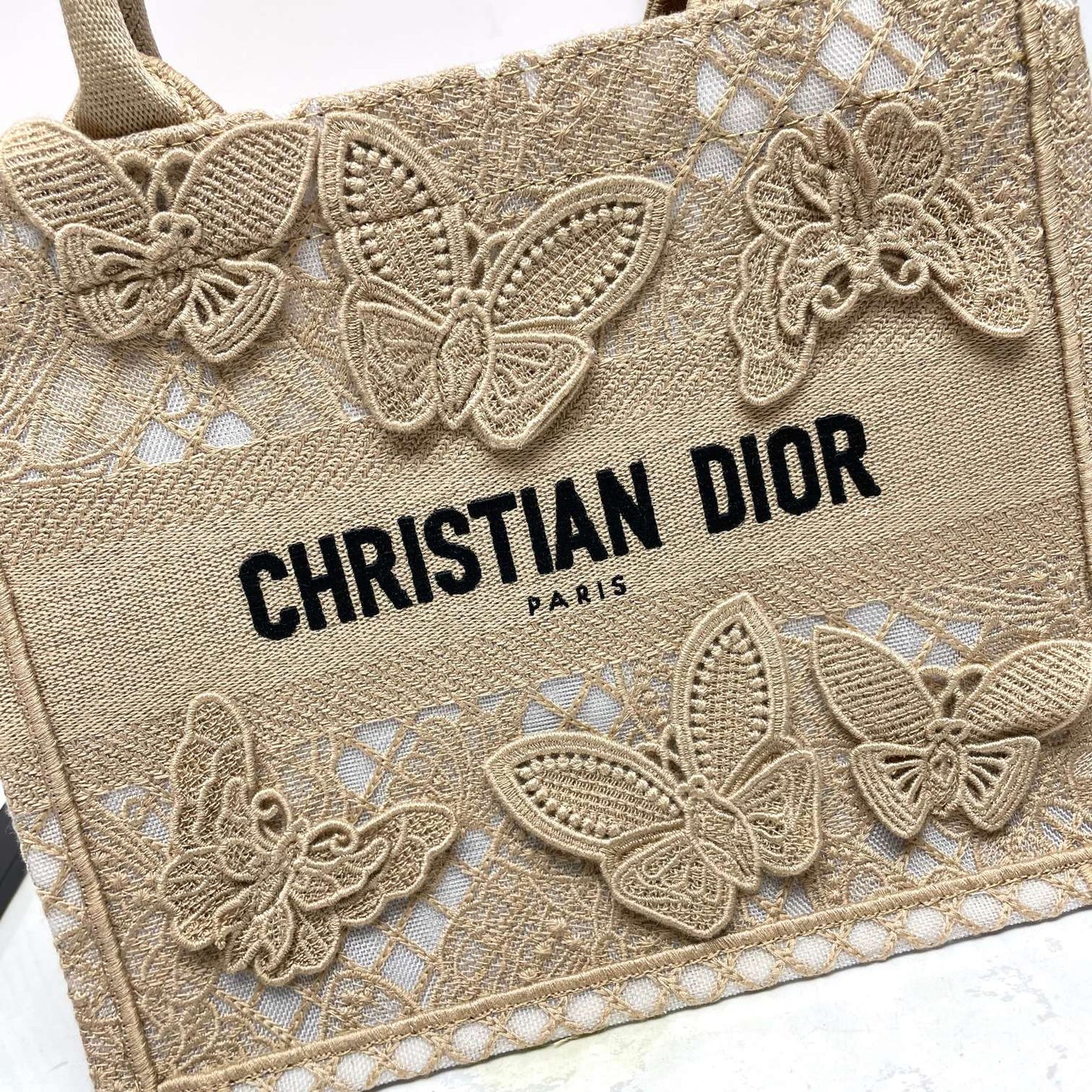 Dior Elegant Beige Canvas Tote Bag with Embroidered Butterfly Details