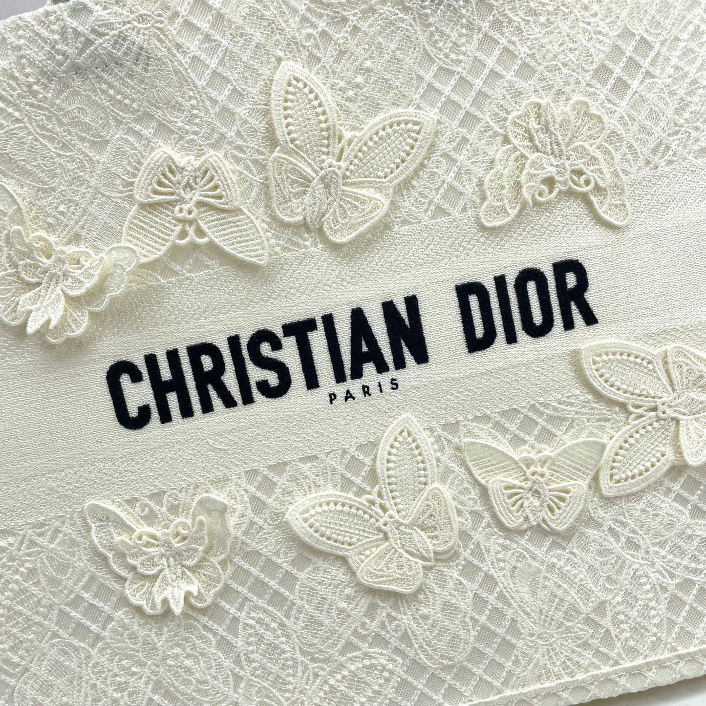 Dior Elegant Cream Canvas Handbag with 3D Textured Butterfly Appliqué