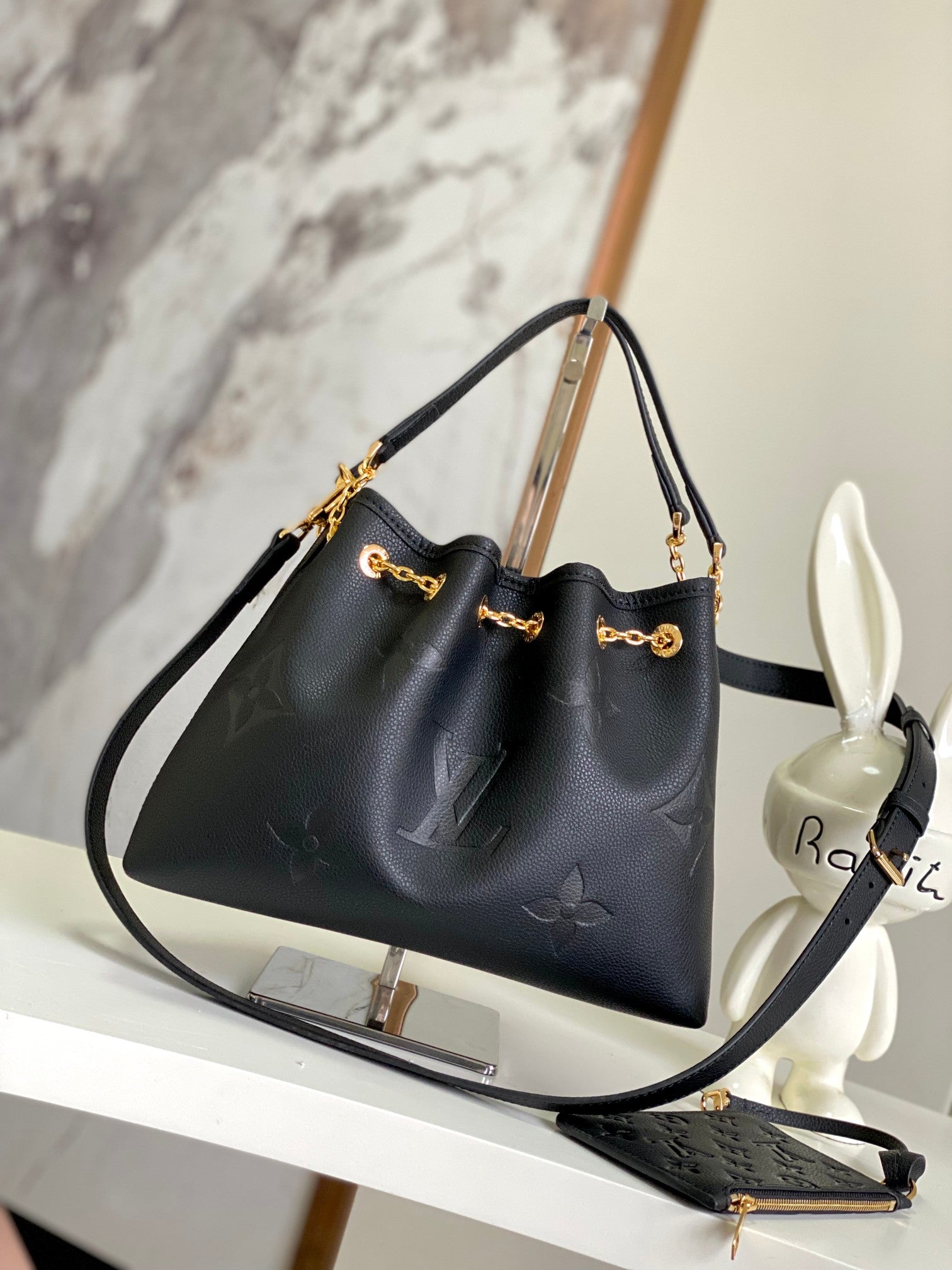 Louis Vuitton Elegant Black Embossed Leather Drawstring Shoulder Bag