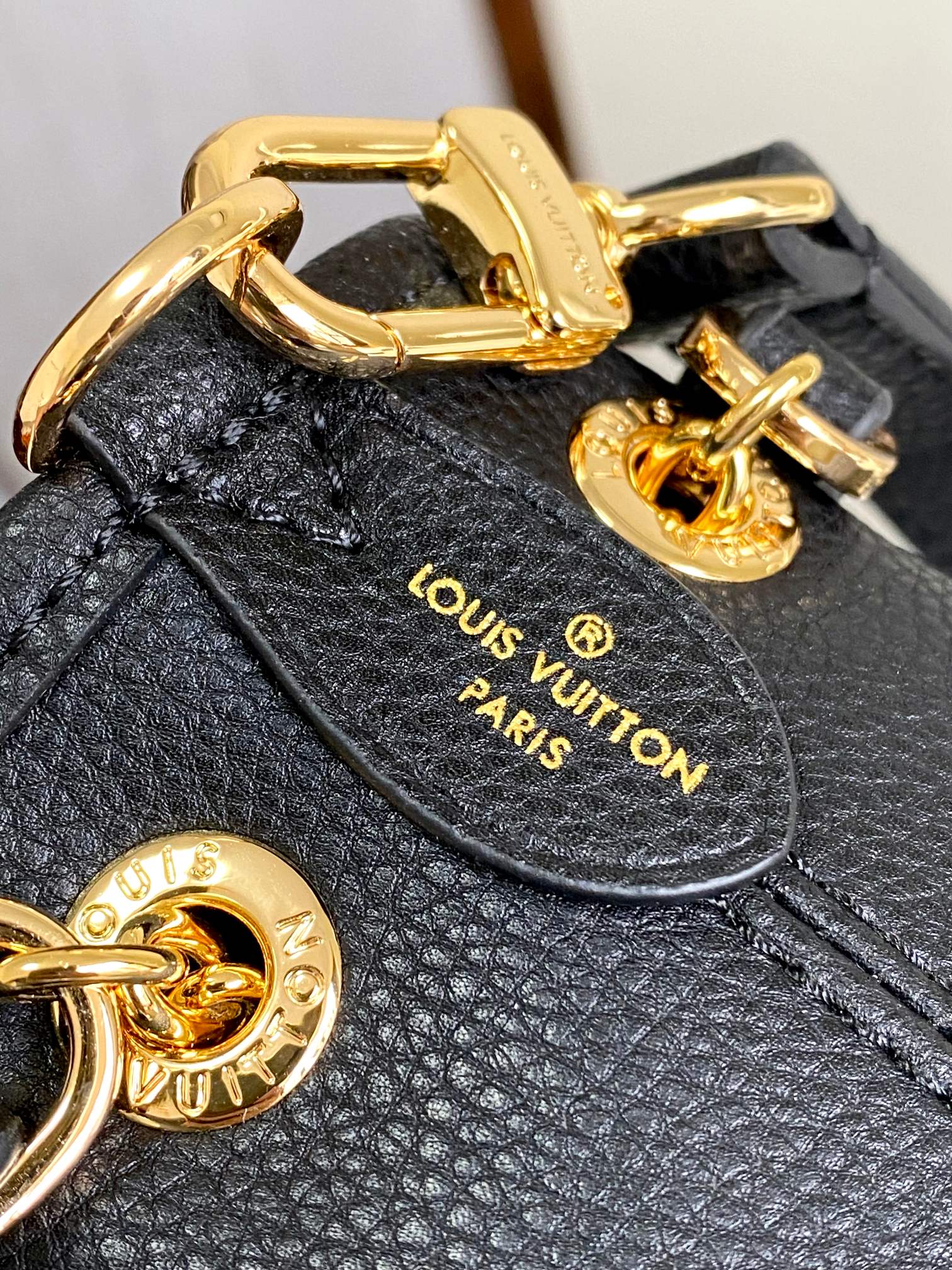 Louis Vuitton Elegant Black Embossed Leather Drawstring Shoulder Bag