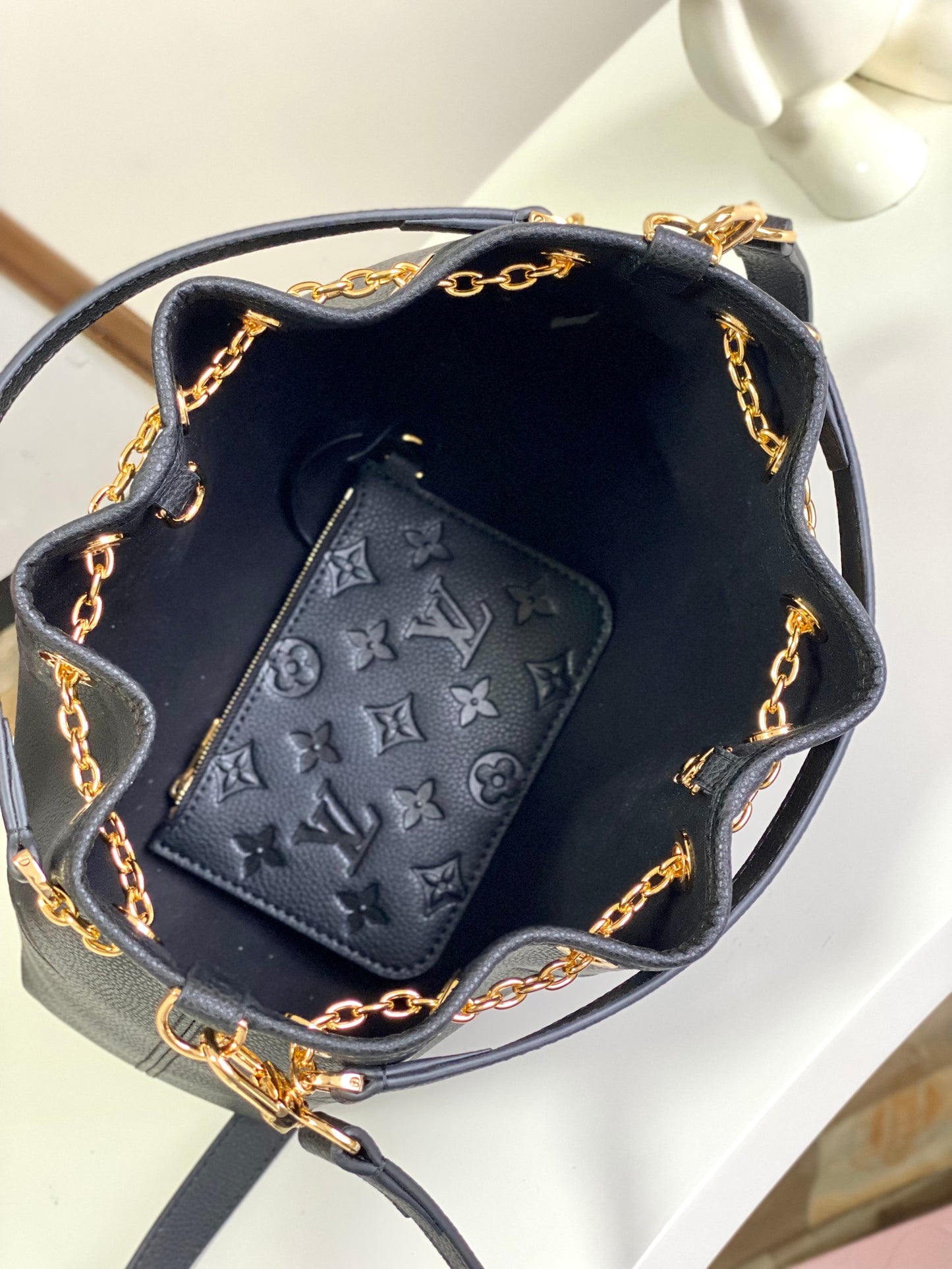 Louis Vuitton Elegant Black Embossed Leather Drawstring Shoulder Bag