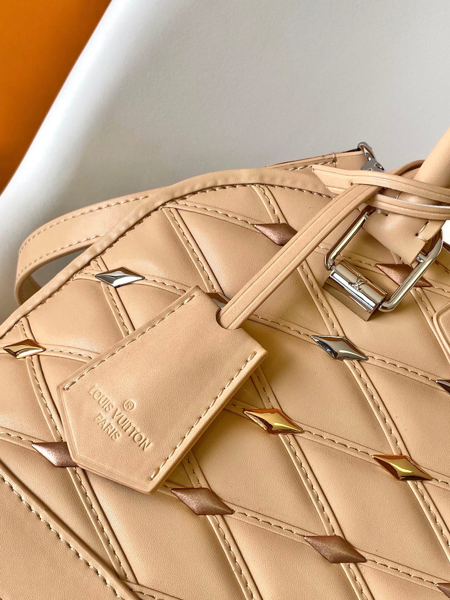 Louis Vuitton Elegant Beige Quilted Leather Dome Handbag with Studs