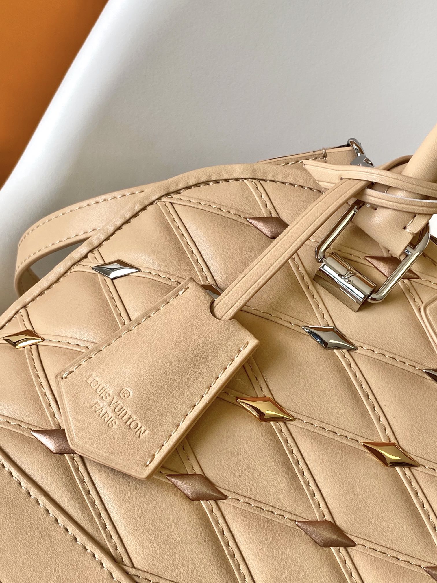 Louis Vuitton Elegant Beige Quilted Leather Dome Handbag with Studs
