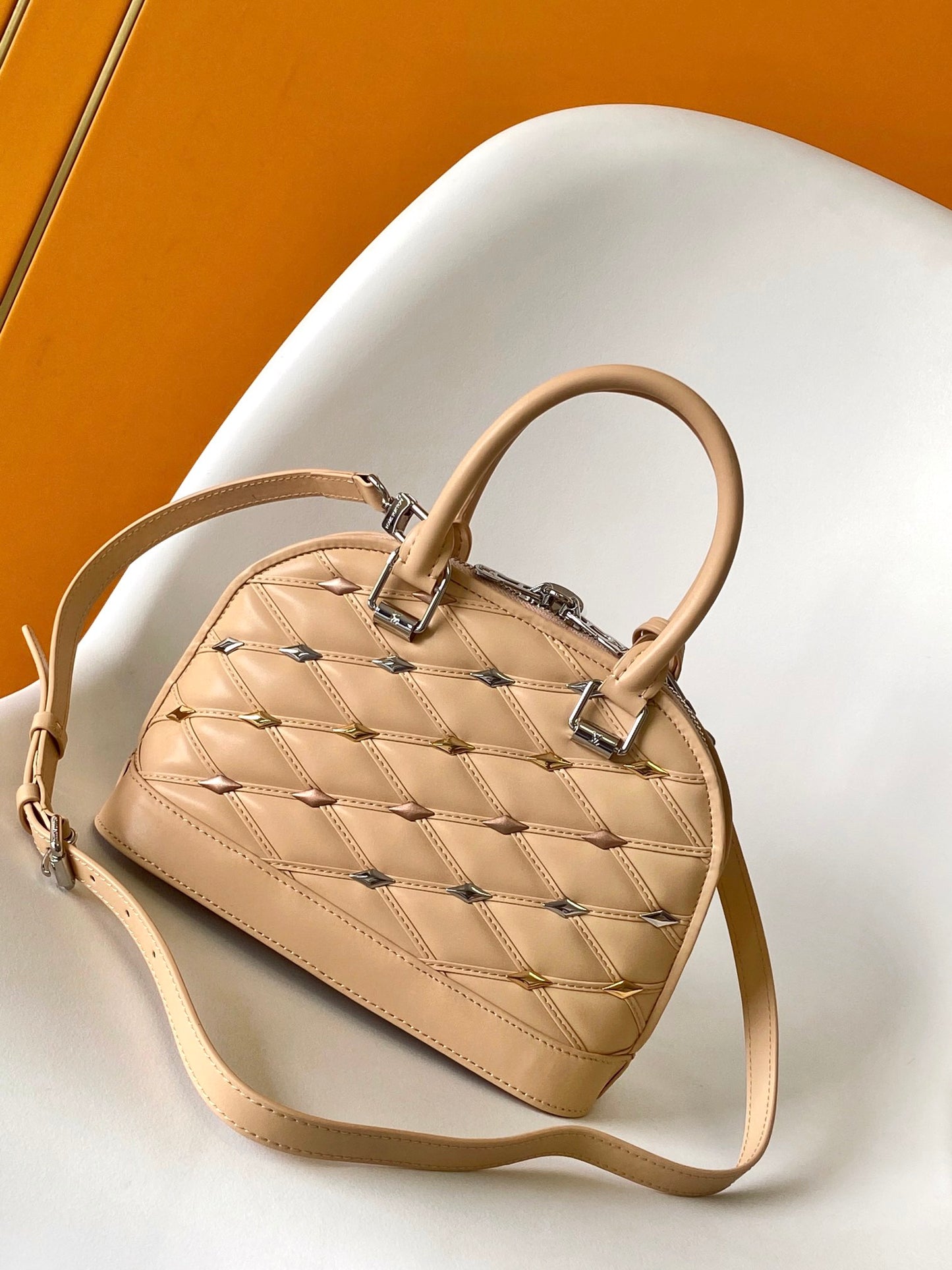 Louis Vuitton Elegant Beige Quilted Leather Dome Handbag with Studs