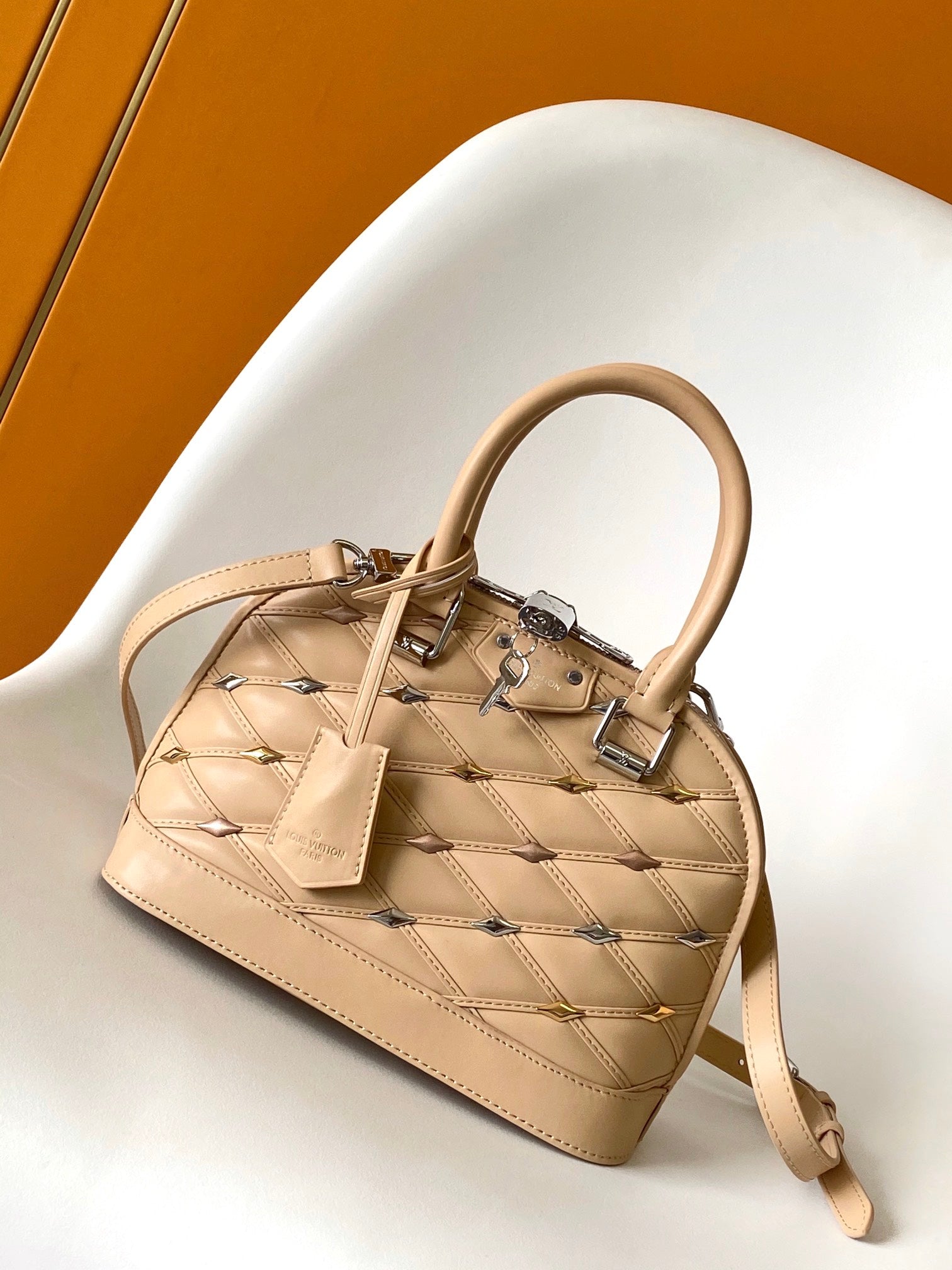 Louis Vuitton Elegant Beige Quilted Leather Dome Handbag with Studs