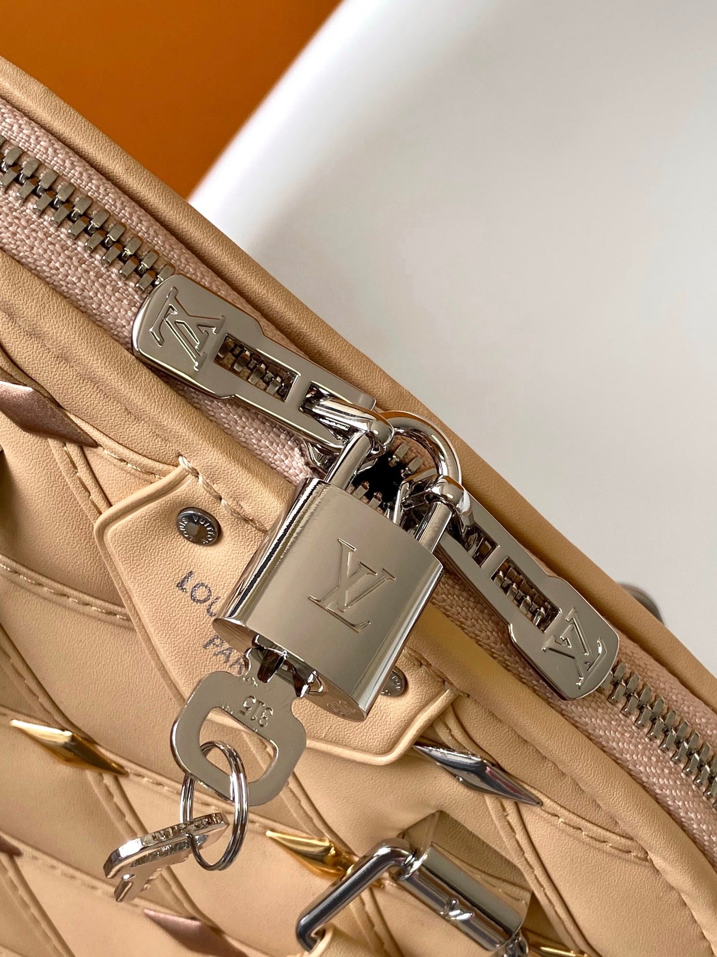 Louis Vuitton Elegant Beige Quilted Leather Dome Handbag with Studs