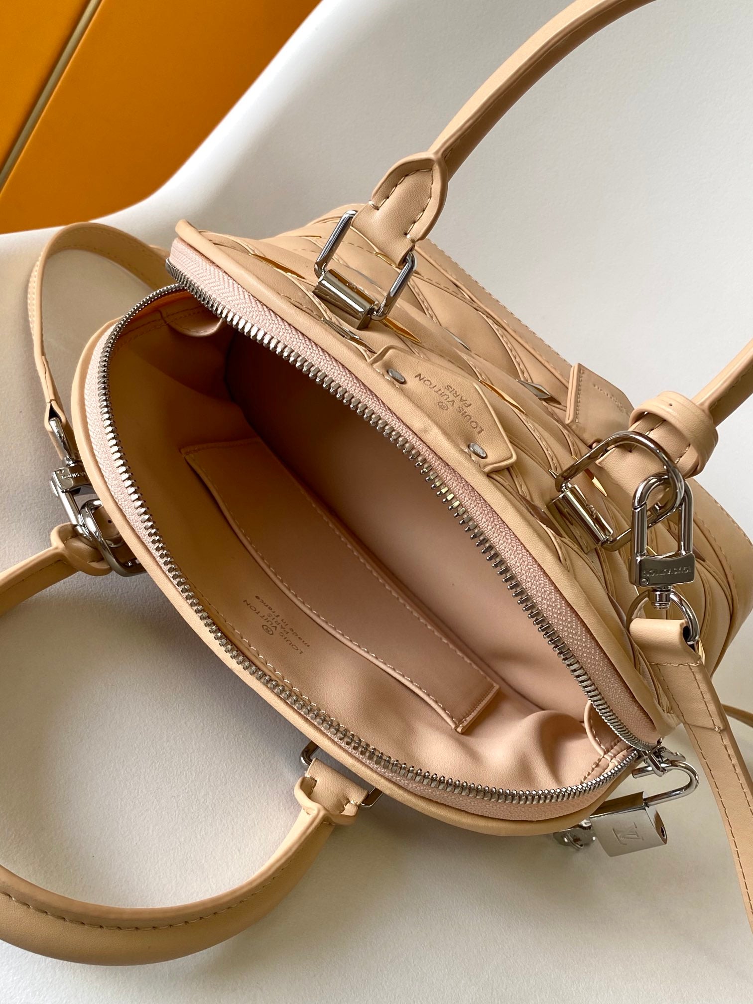 Louis Vuitton Elegant Beige Quilted Leather Dome Handbag with Studs