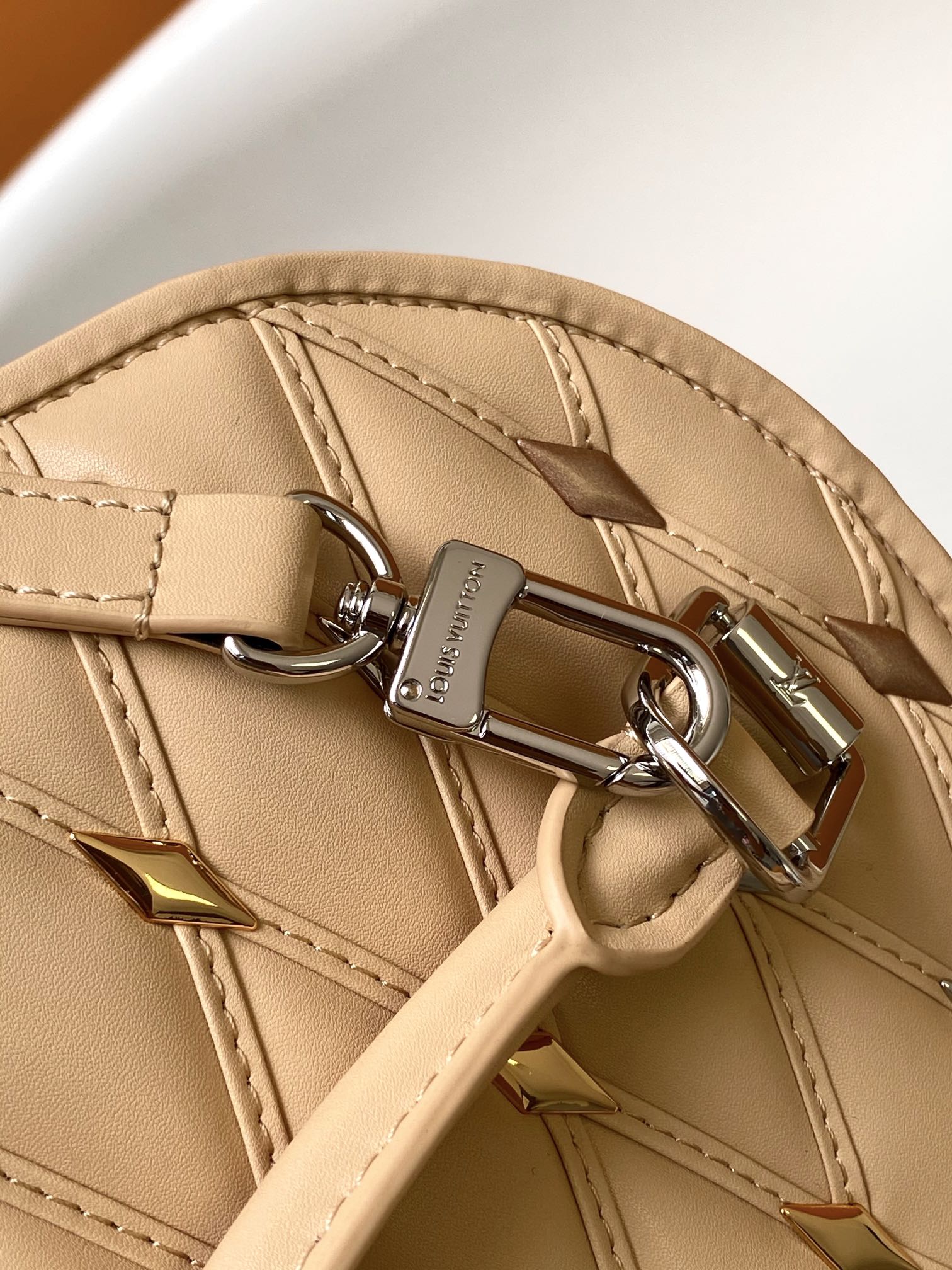 Louis Vuitton Elegant Beige Quilted Leather Dome Handbag with Studs