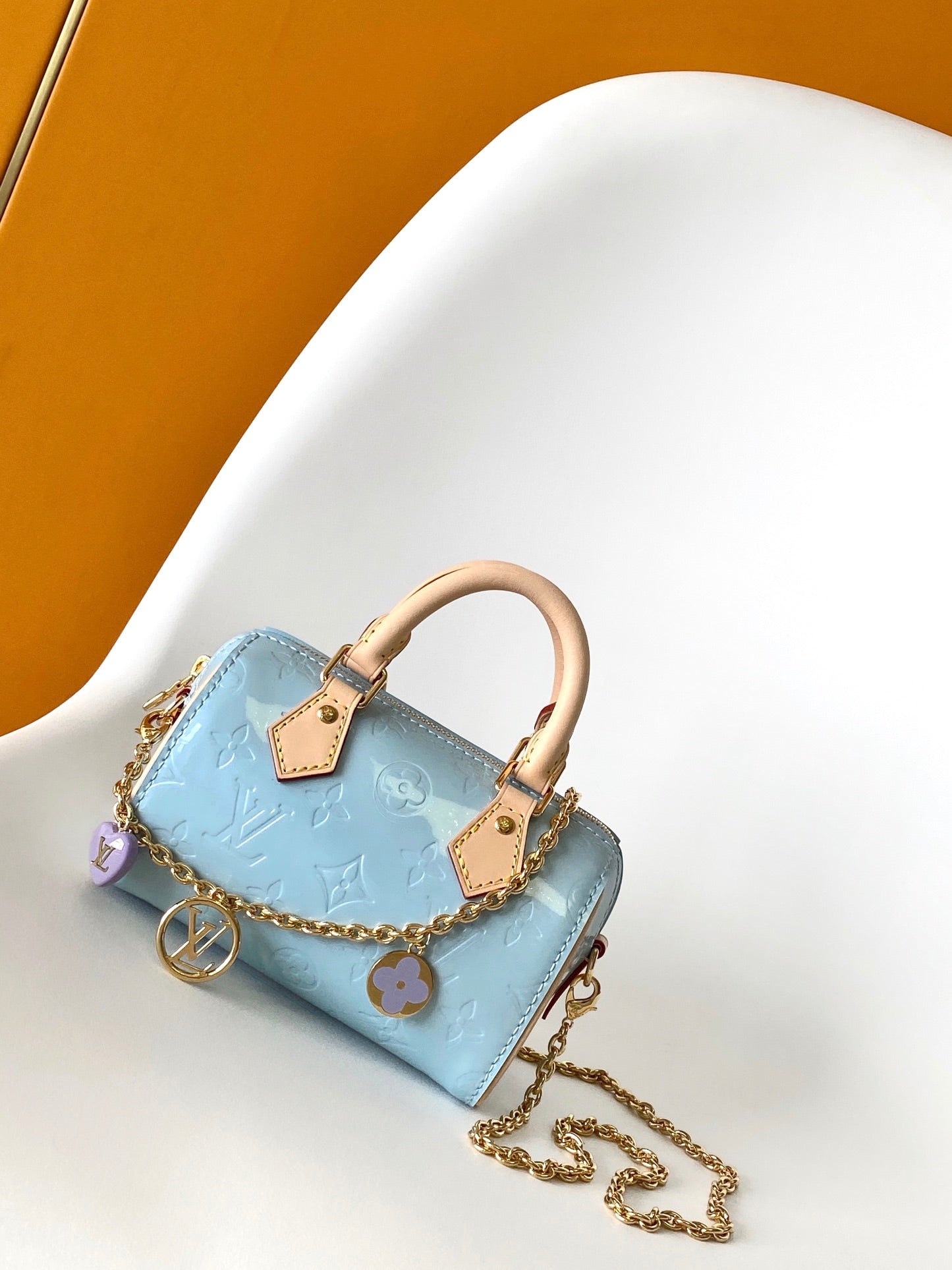 Louis Vuitton Pastel Blue Embossed Crossbody Barrel Bag with Gold Chain and Heart Charm