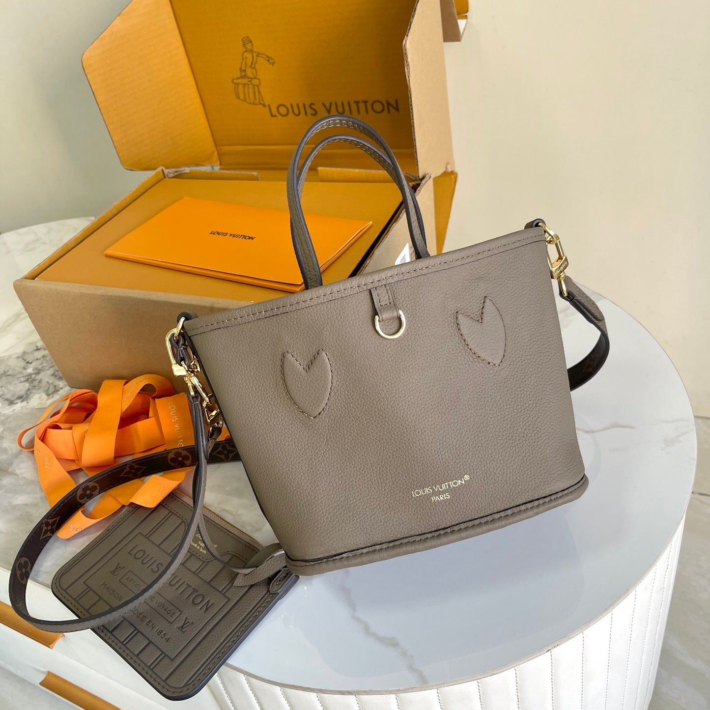 Louis Vuitton Taupe Leather Bucket Handbag with Top Handles and Shoulder Strap