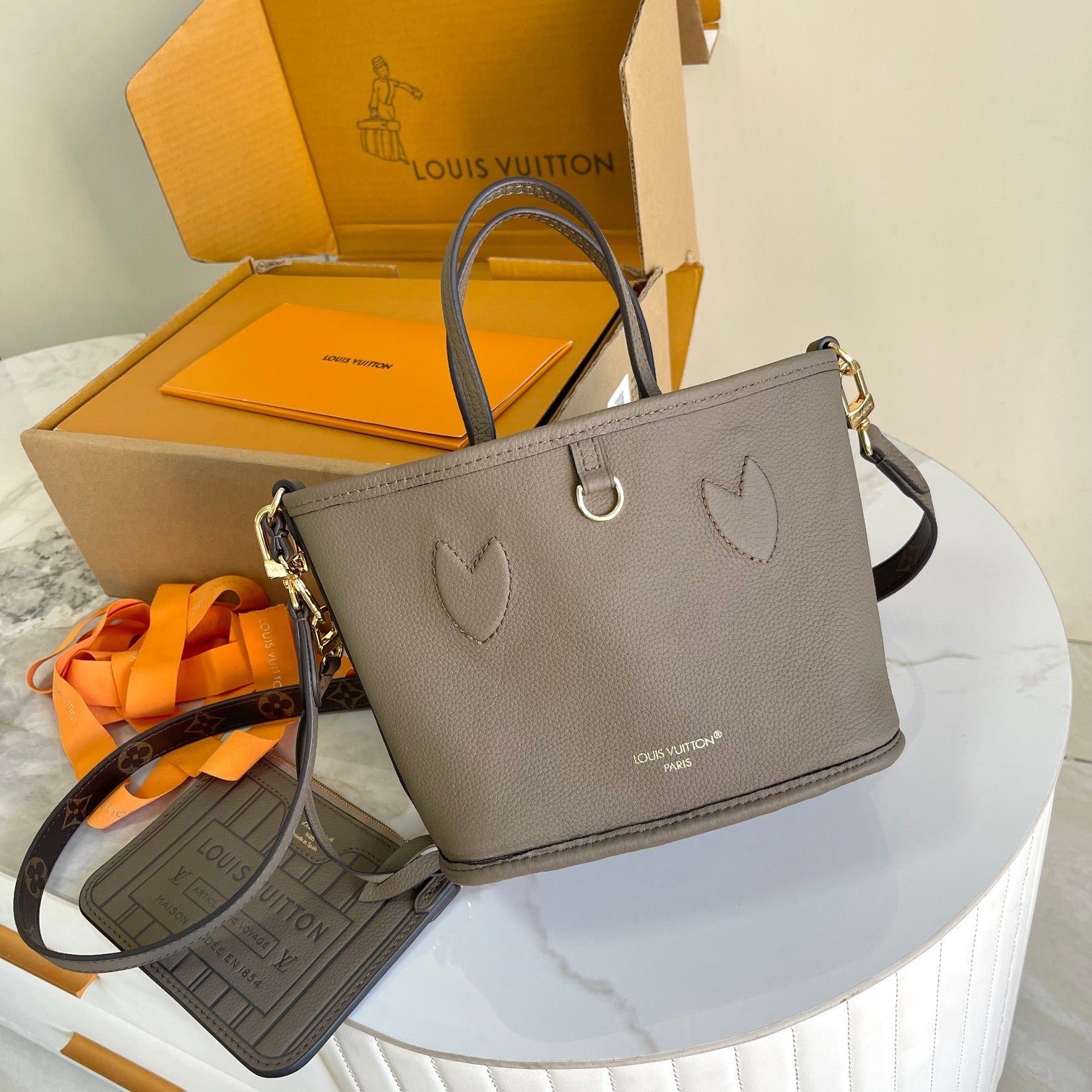 Louis Vuitton Taupe Leather Bucket Handbag with Top Handles and Shoulder Strap