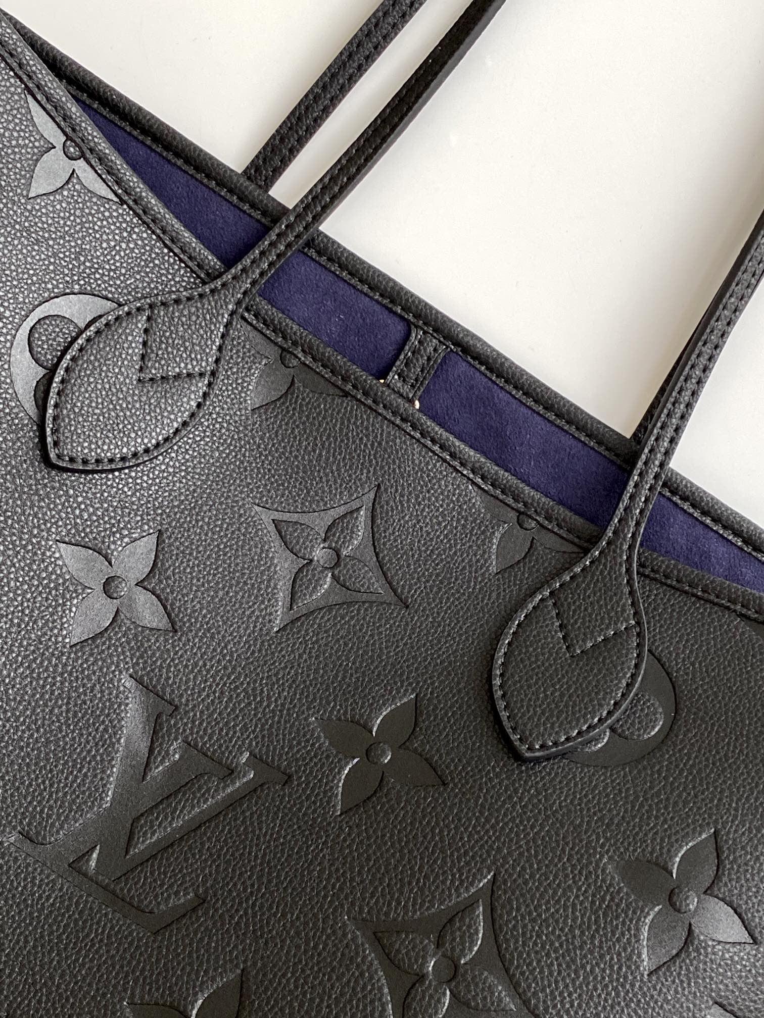 Louis Vuitton Elegant Black Embossed Leather Tote Bag with Double Handles
