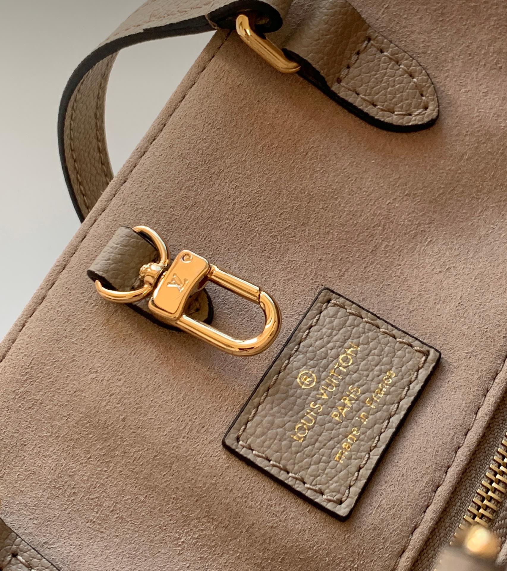 Louis Vuitton Elegant Taupe Leather Tote Bag with Large Embossed Monogram