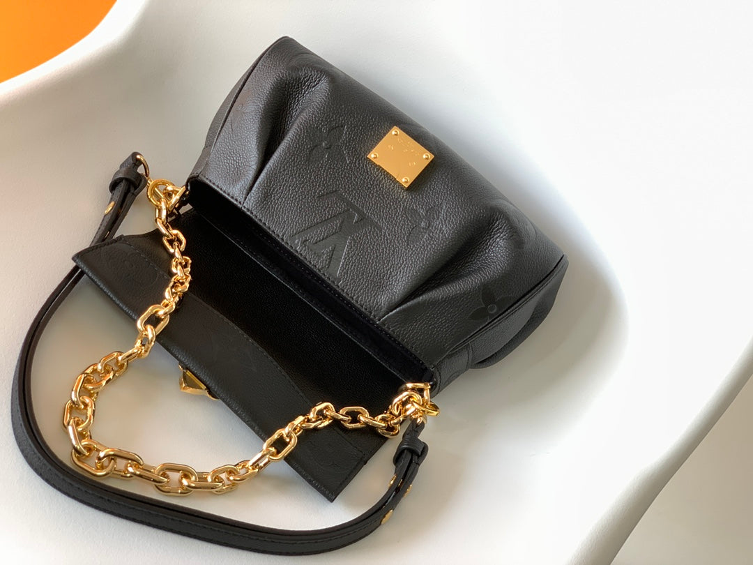 Louis Vuitton Elegant Black Embossed Leather Flap Bag with Gold Chain