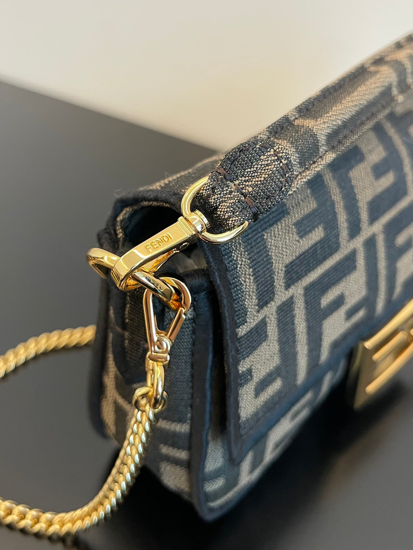 Fendi Mini Baguette Bag in Iconic FF Logo Canvas with Gold-Tone Hardware