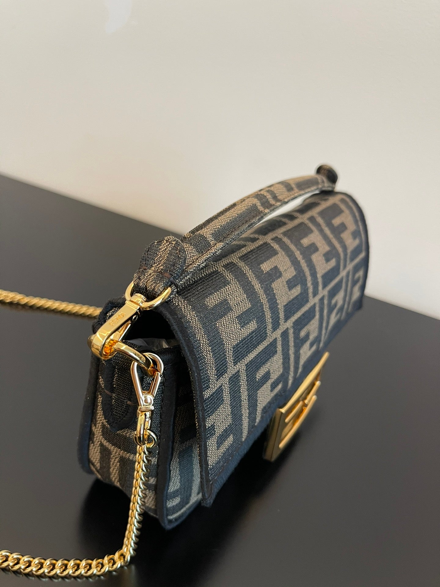 Fendi Mini Baguette Bag in Iconic FF Logo Canvas with Gold-Tone Hardware