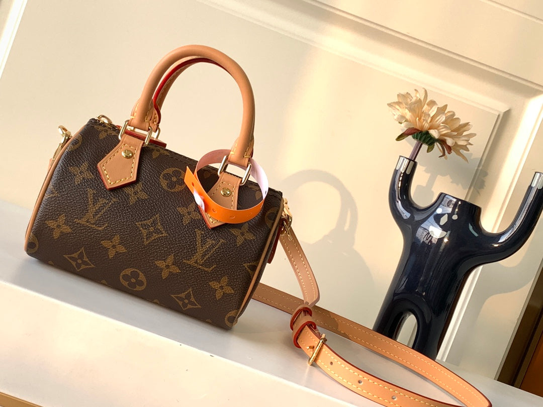 Louis Vuitton Classic Brown Monogram Mini Barrel Handbag with Leather Strap