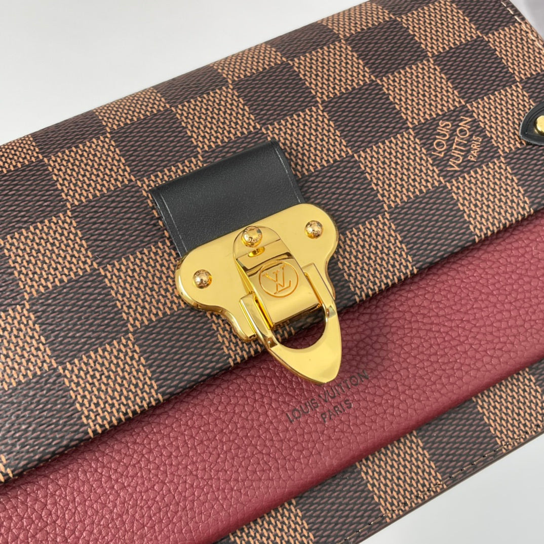 Louis Vuitton Brown Checkered Crossbody Bag with Gold Chain and Red Accent