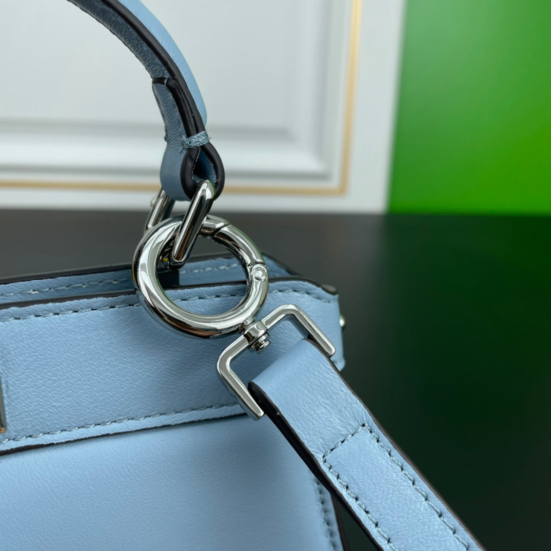 Elegant Light Blue Top Handle Leather Handbag with Adjustable Shoulder Strap