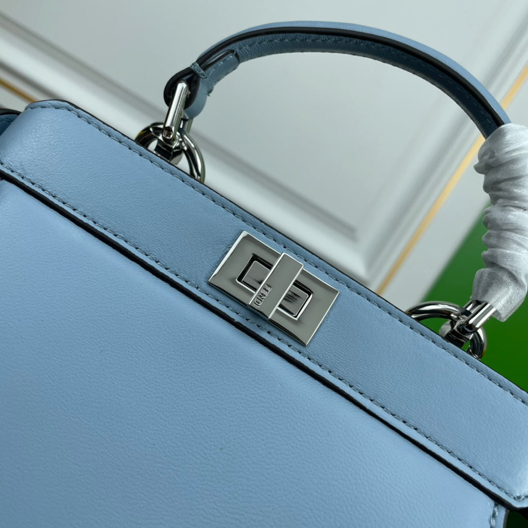 Elegant Light Blue Top Handle Leather Handbag with Adjustable Shoulder Strap