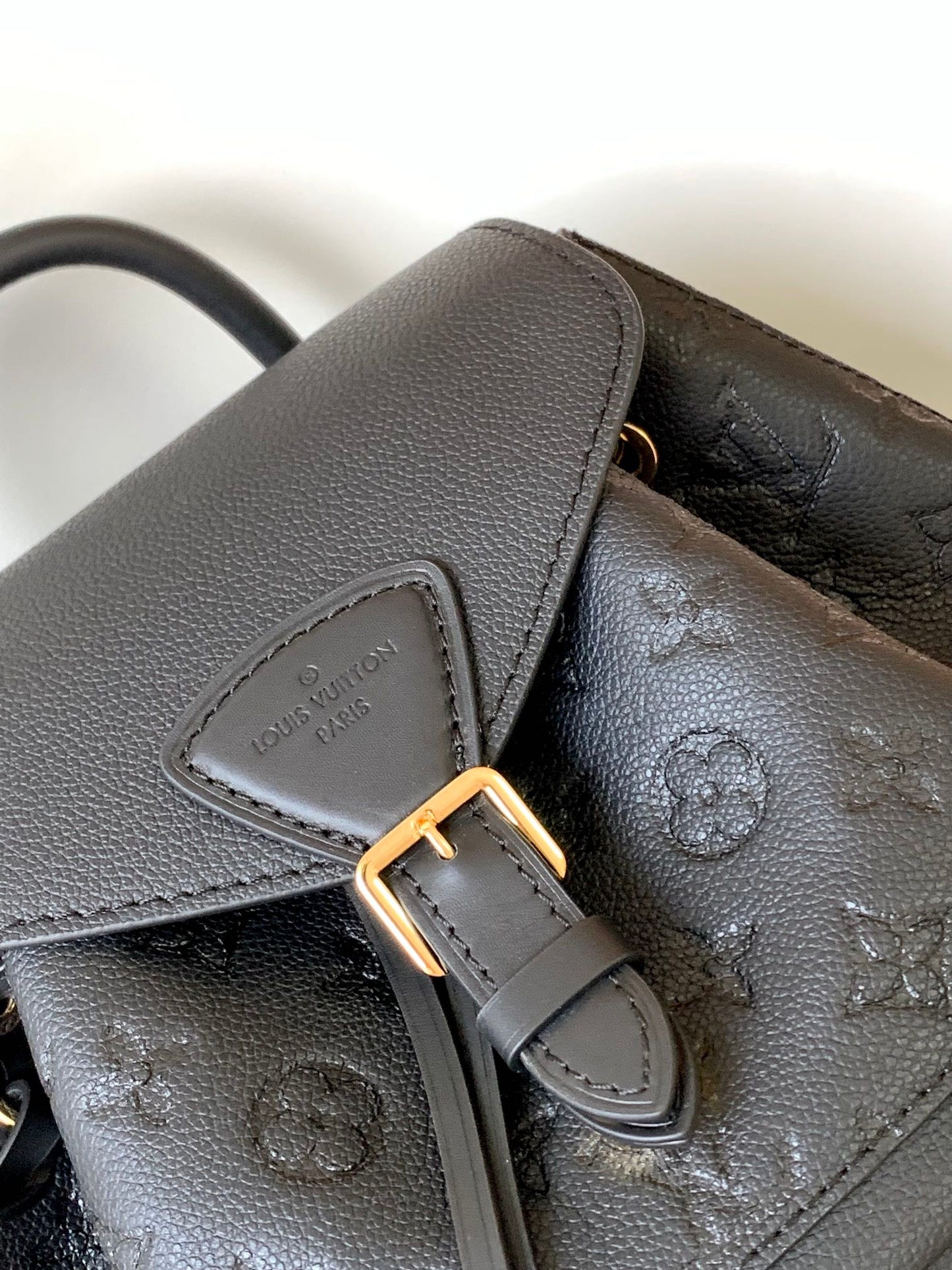 Louis Vuitton Elegant Black Embossed Leather Small Backpack with Flap Closure