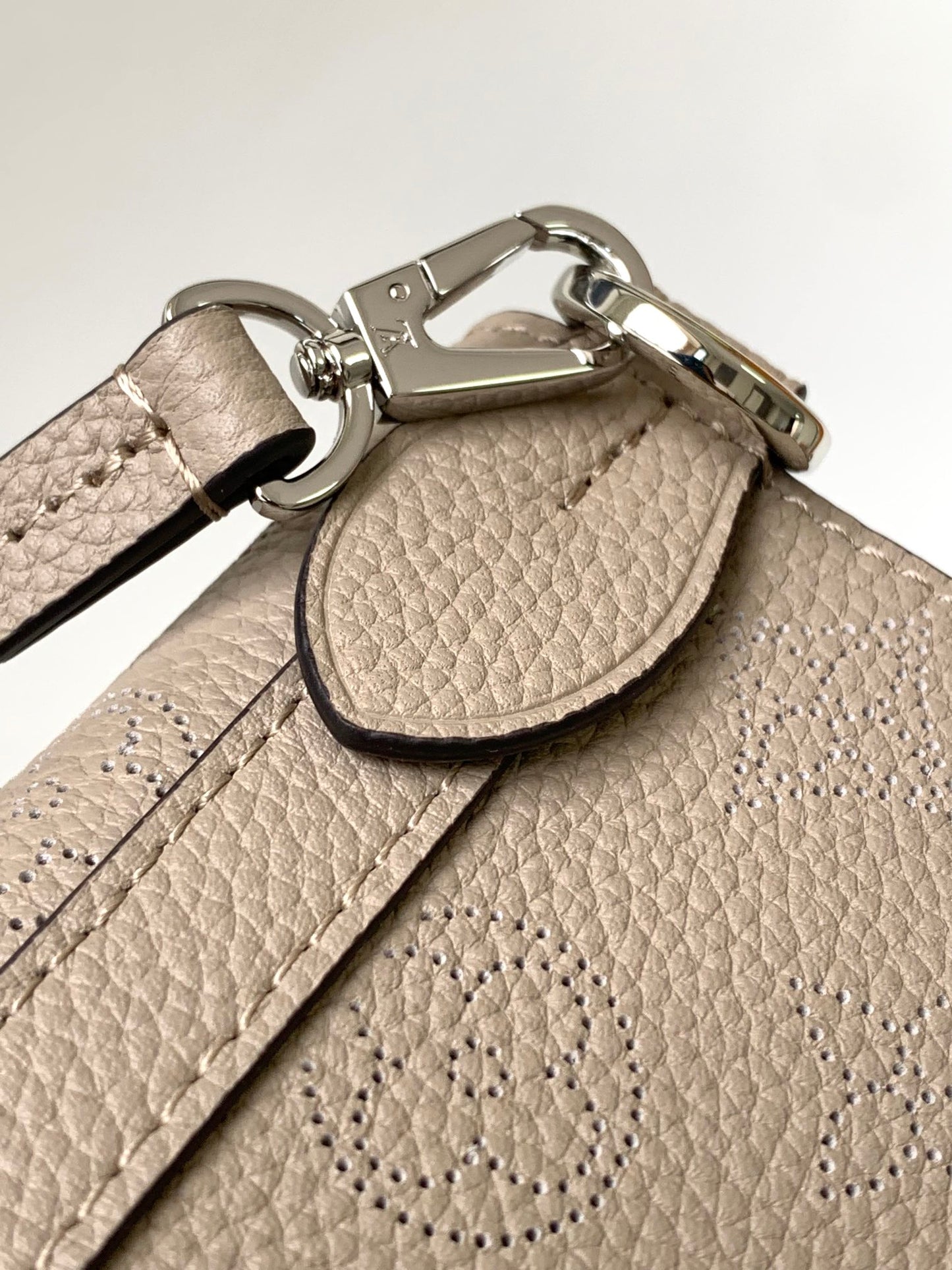 Louis Vuitton Elegant Taupe Perforated Leather Tote Handbag with Charm