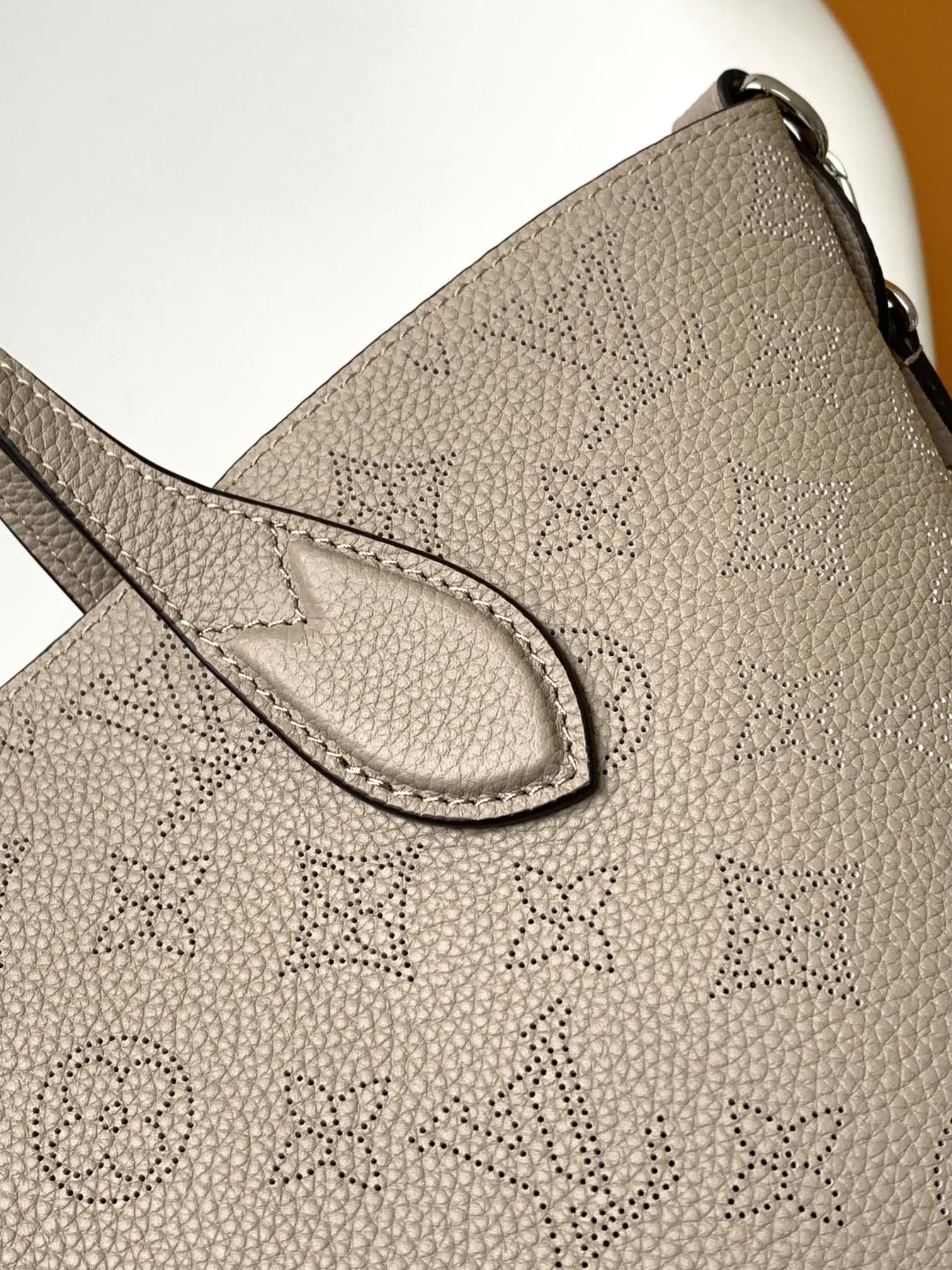 Louis Vuitton Elegant Taupe Perforated Leather Tote Handbag with Charm