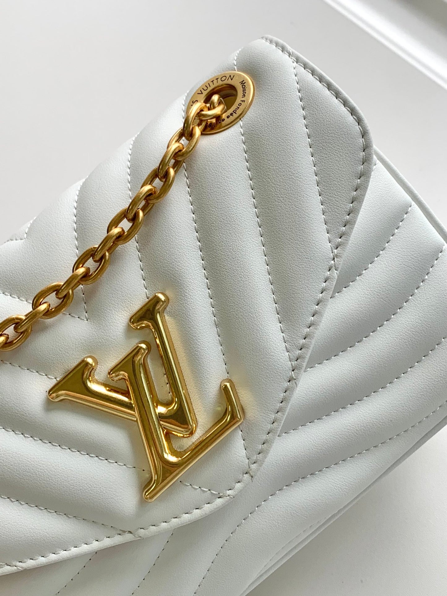 Louis Vuitton Elegant White Chevron Quilted Leather Handbag with Gold Chain