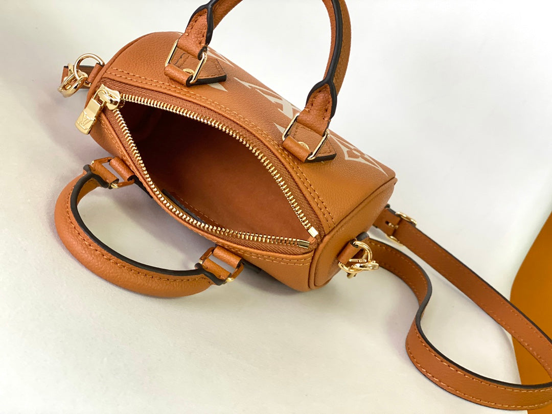 Louis Vuitton Classic Tan Monogram Mini Duffle Handbag with Adjustable Shoulder Strap