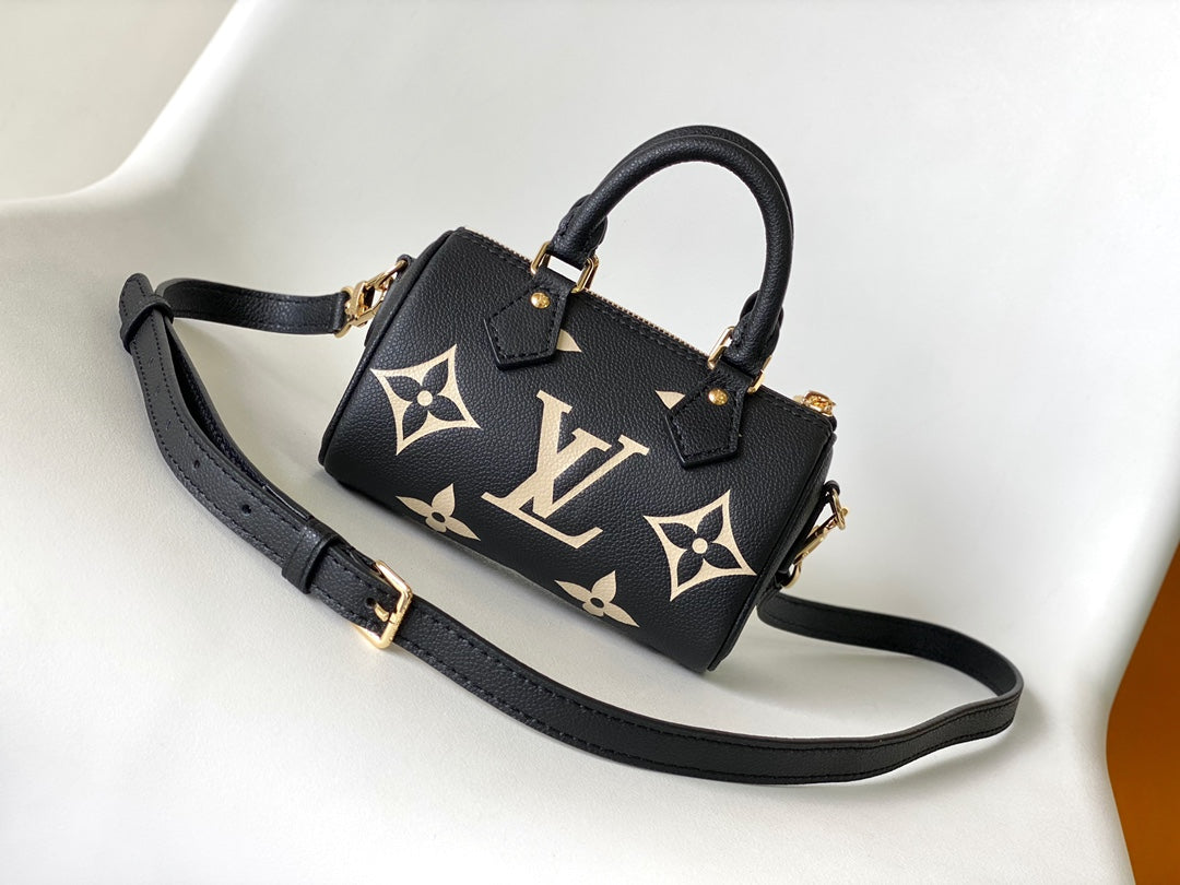 Louis Vuitton Elegant Black Mini Barrel Handbag with Gold Monogram Motifs