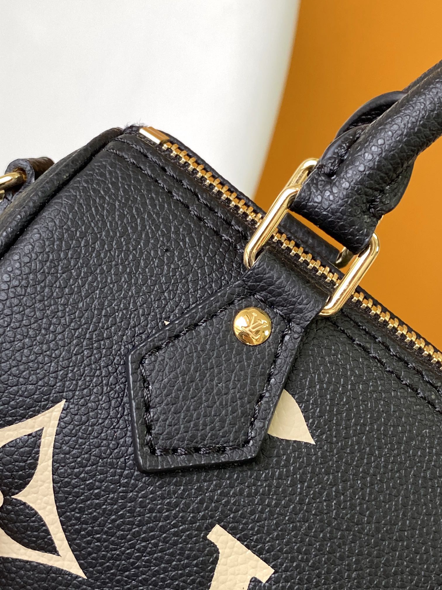 Louis Vuitton Elegant Black Mini Barrel Handbag with Gold Monogram Motifs