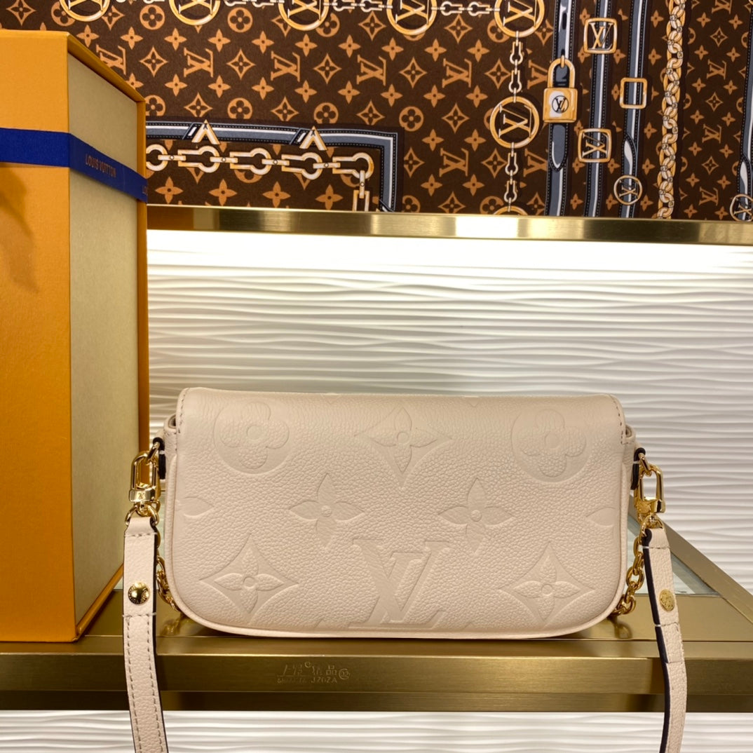 Louis Vuitton Elegant Beige Embossed Leather Shoulder Bag with Gold Chain