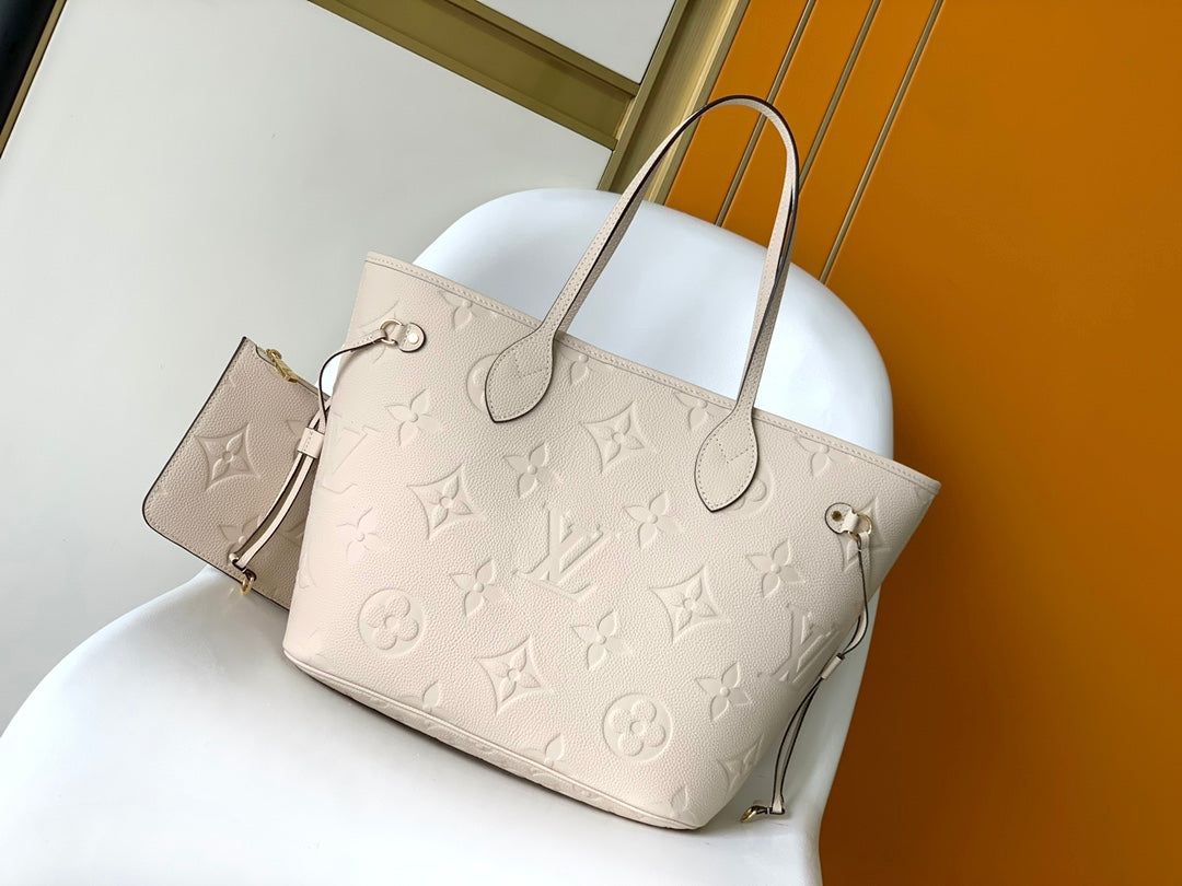 Louis Vuitton Elegant Beige Embossed Leather Tote Bag with Side Drawstrings